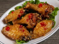 Order 8. Chicken Wings with Garlic Butter food online from Saigon Noodles & Grill store, Arlington on bringmethat.com