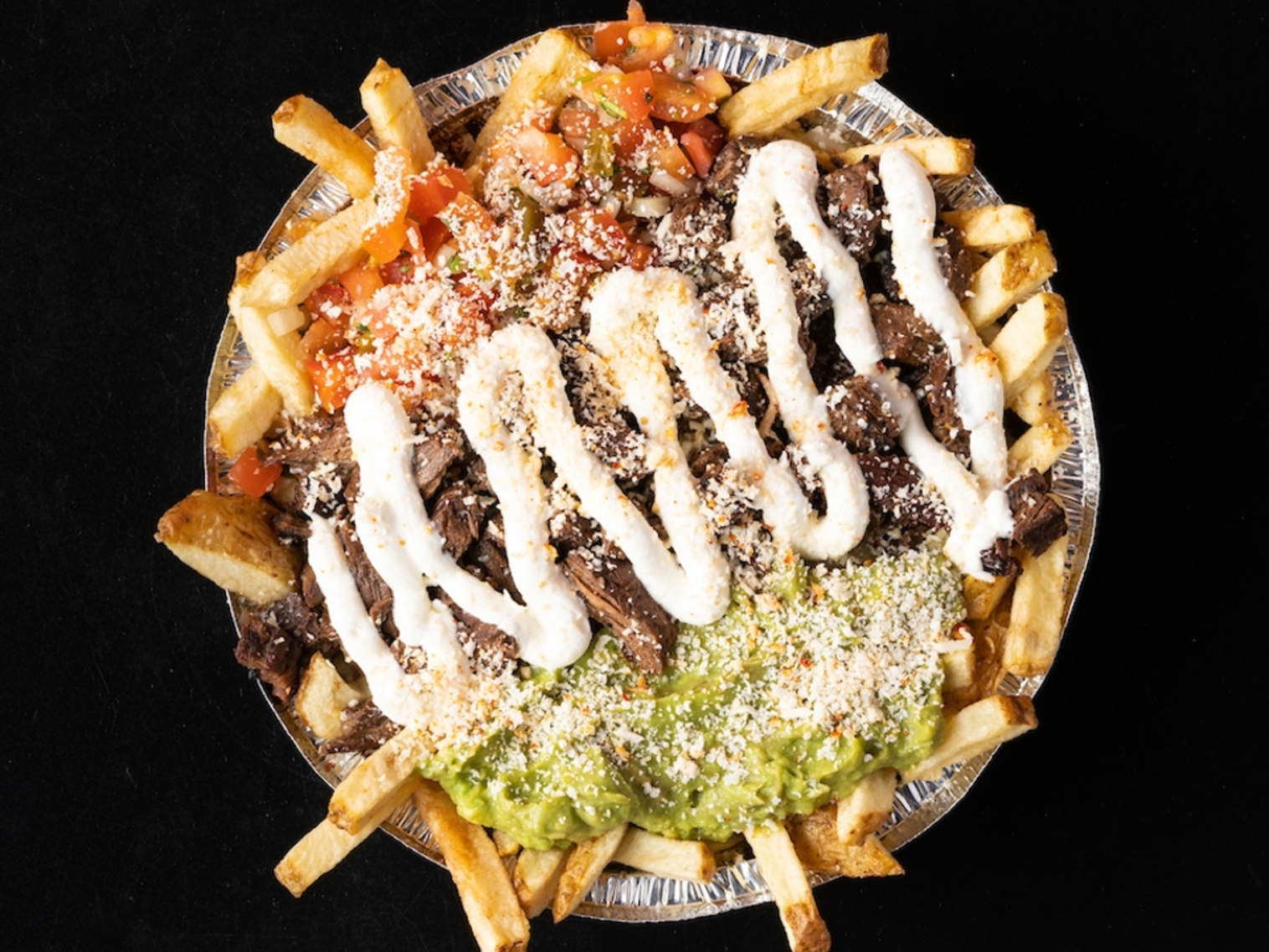 Order Champion Fries food online from Lucha Libre Taco Shop store, San Diego on bringmethat.com