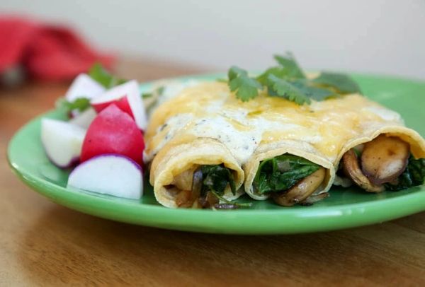 Order Wild Mushroom Enchilada and Spanish Rice food online from The Spice Of Life Catering store, Carrollton on bringmethat.com