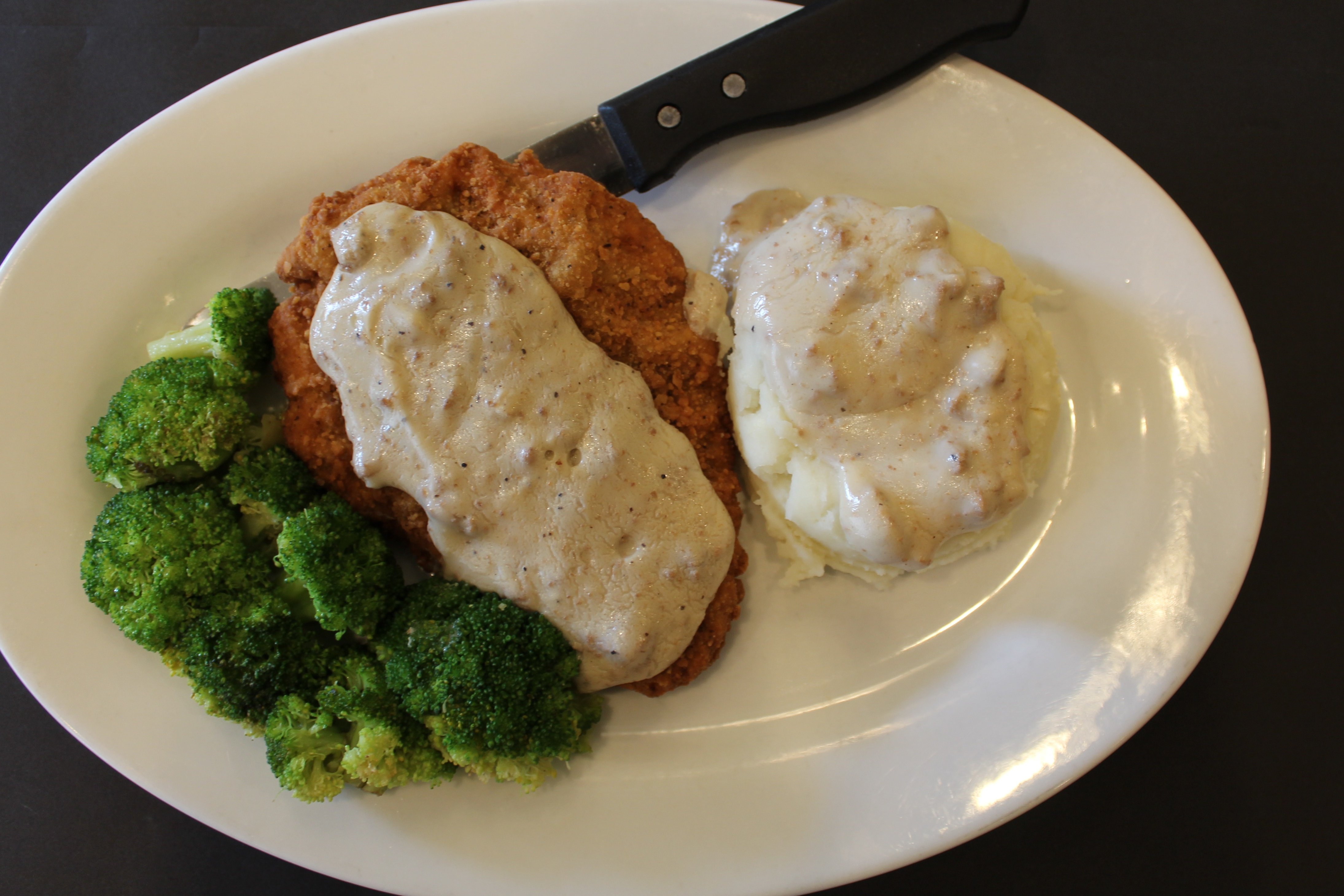 Order Country Fried Steak with Gravy food online from Kings Family Restaurants store, Greensburg on bringmethat.com