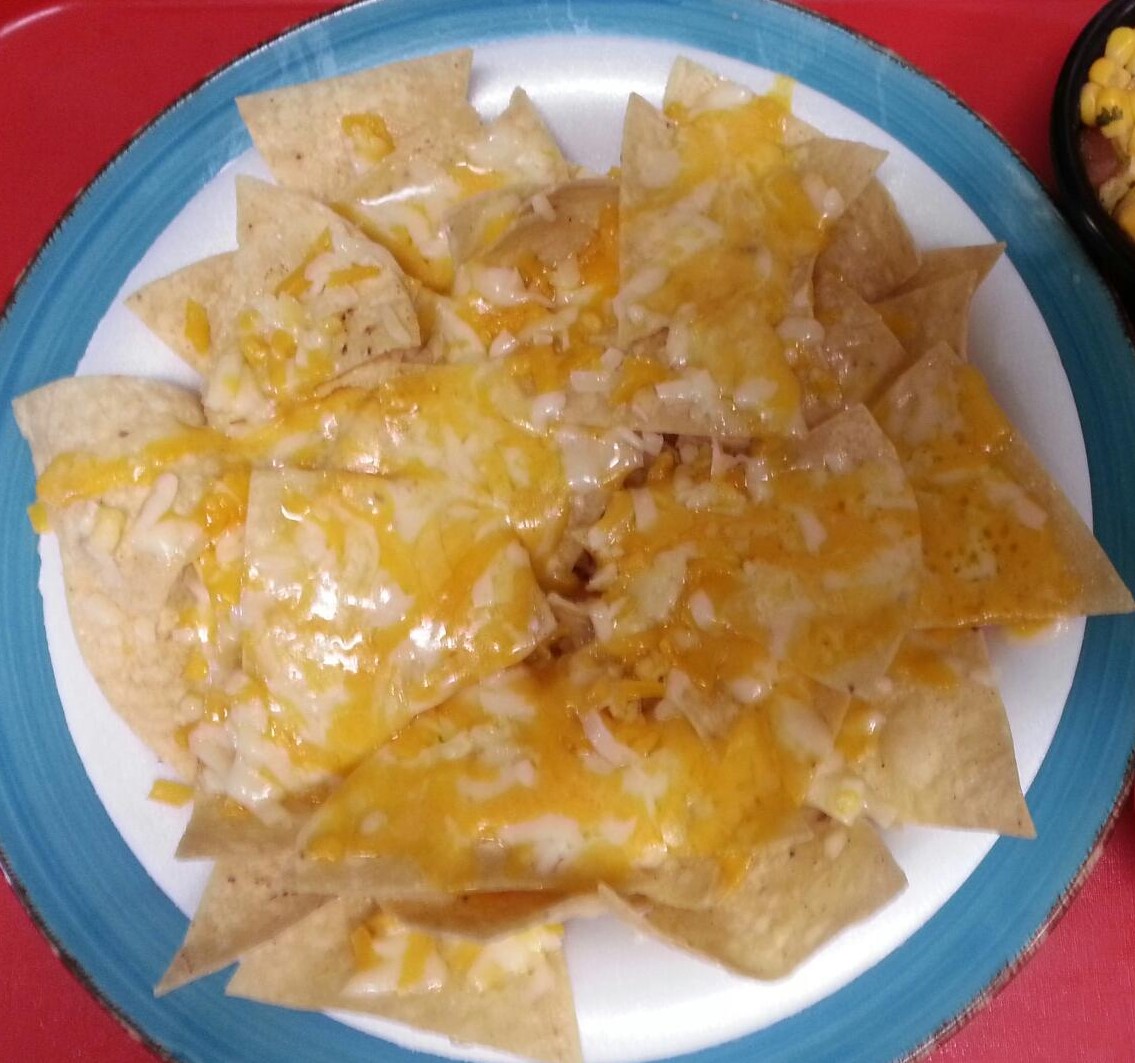 Order Nachos / 2 oz salsa food online from Tacos And Wings store, Sunland on bringmethat.com