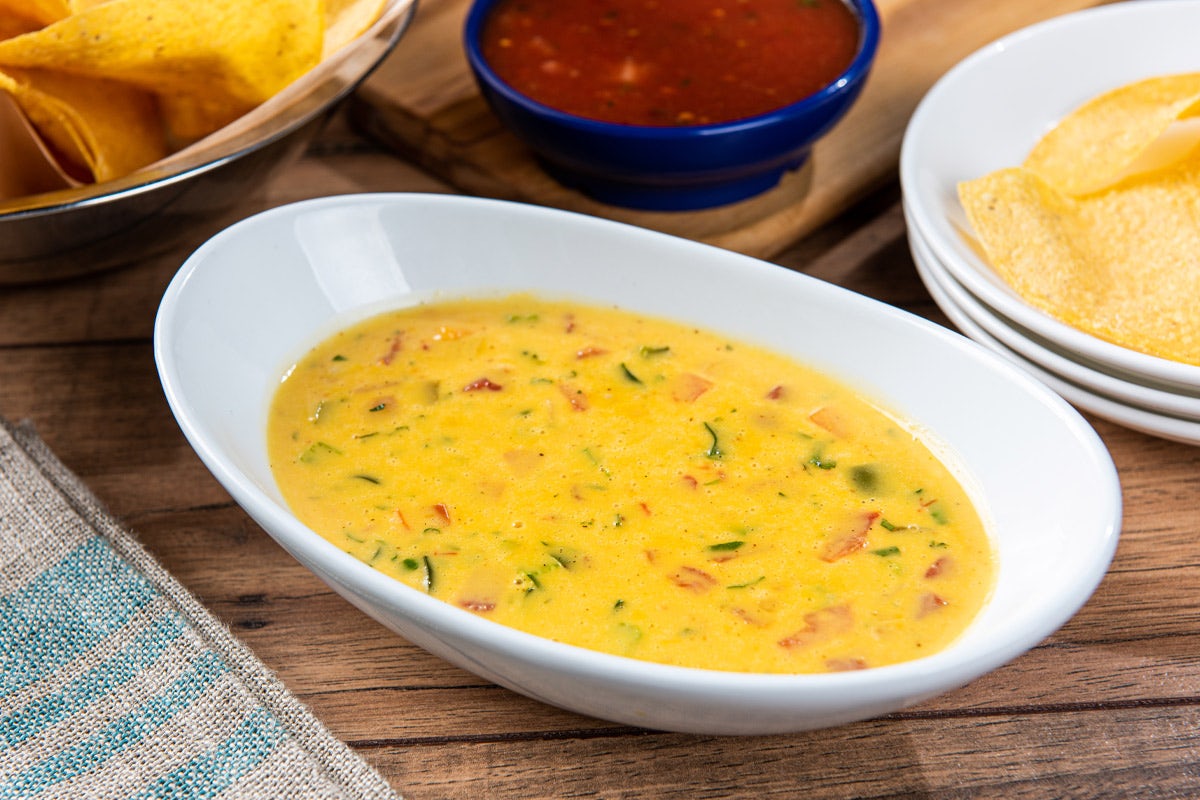 Order Signature Queso food online from On The Border store, Littleton on bringmethat.com