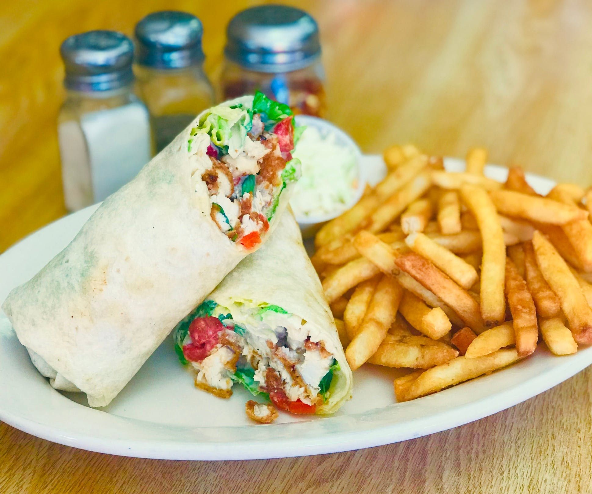 Order Crispy Chicken Caesar Wrap - Wrap food online from Nonna Rosa Pizzeria store, Norristown on bringmethat.com