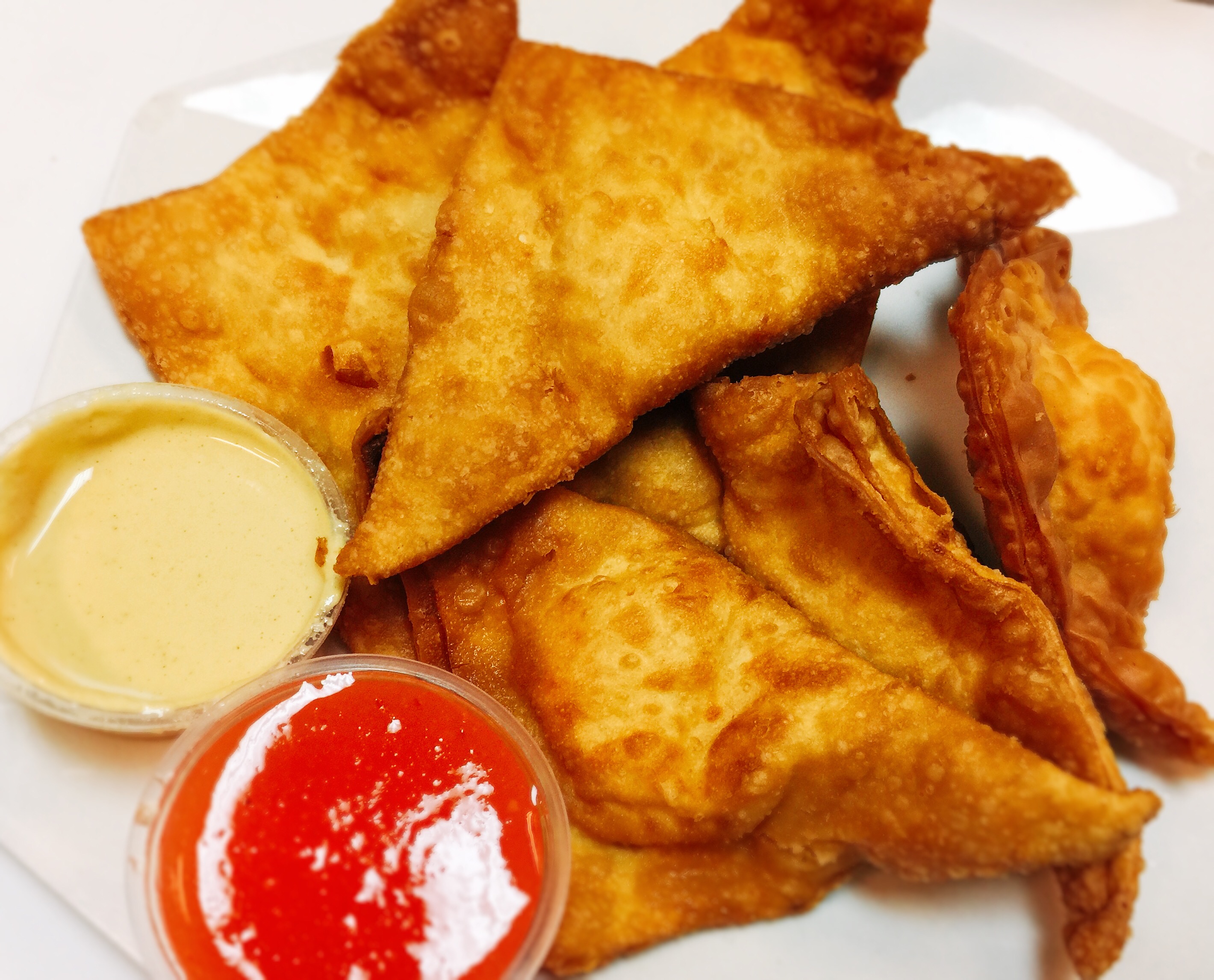 Order 106. Crab Meat Rangoons  炸蟹角 food online from Noodles Delight store, Roselle on bringmethat.com