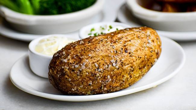 Order Salt and Pepper Crusted Baked Potato with Butter and Sour Cream food online from Carson store, Milwaukee on bringmethat.com