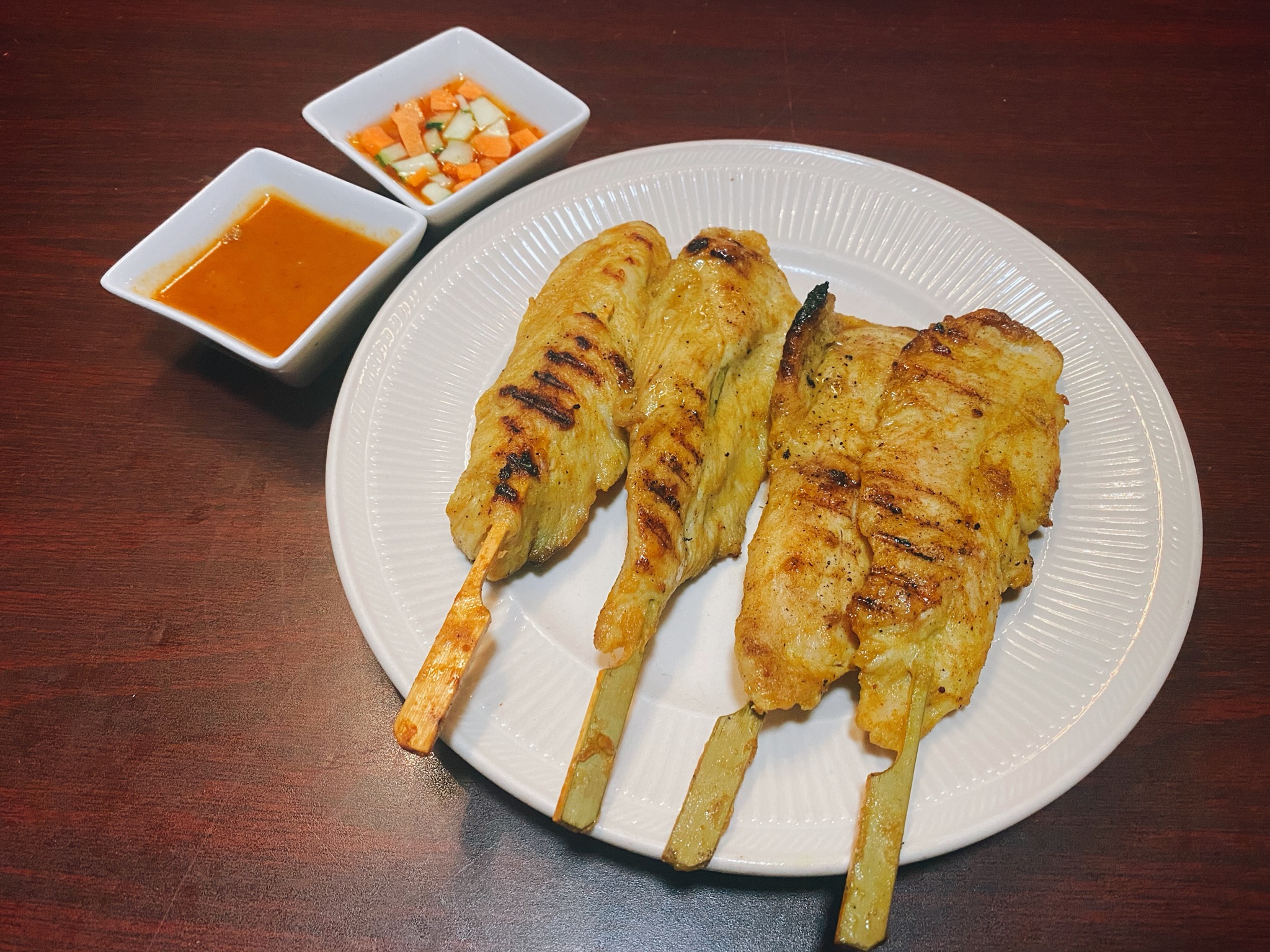 Order 4 Pieces Chicken Satay food online from Yummy thai cuisine store, Cambridge on bringmethat.com