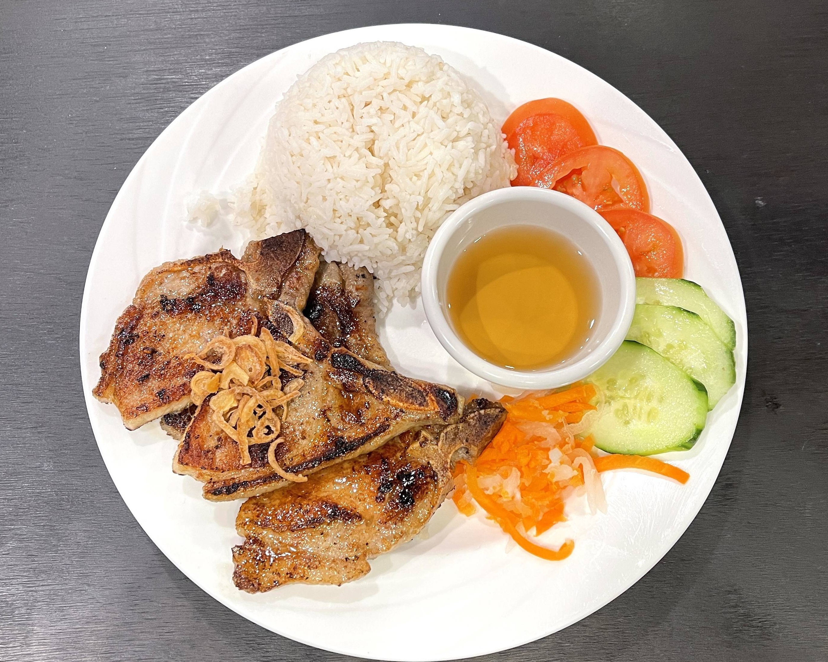 Order R1 Porkchops with Rice food online from Indochine store, New Brunswick on bringmethat.com