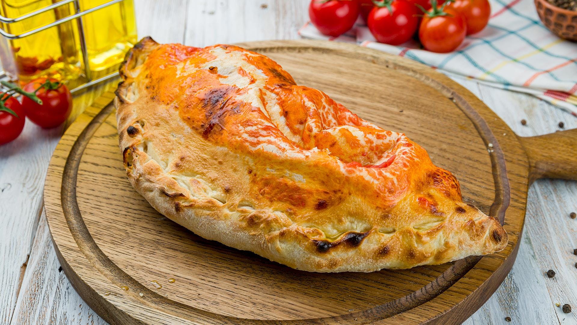 Order Calzone - Calzone food online from Roma Italian Restaurant store, Athens on bringmethat.com