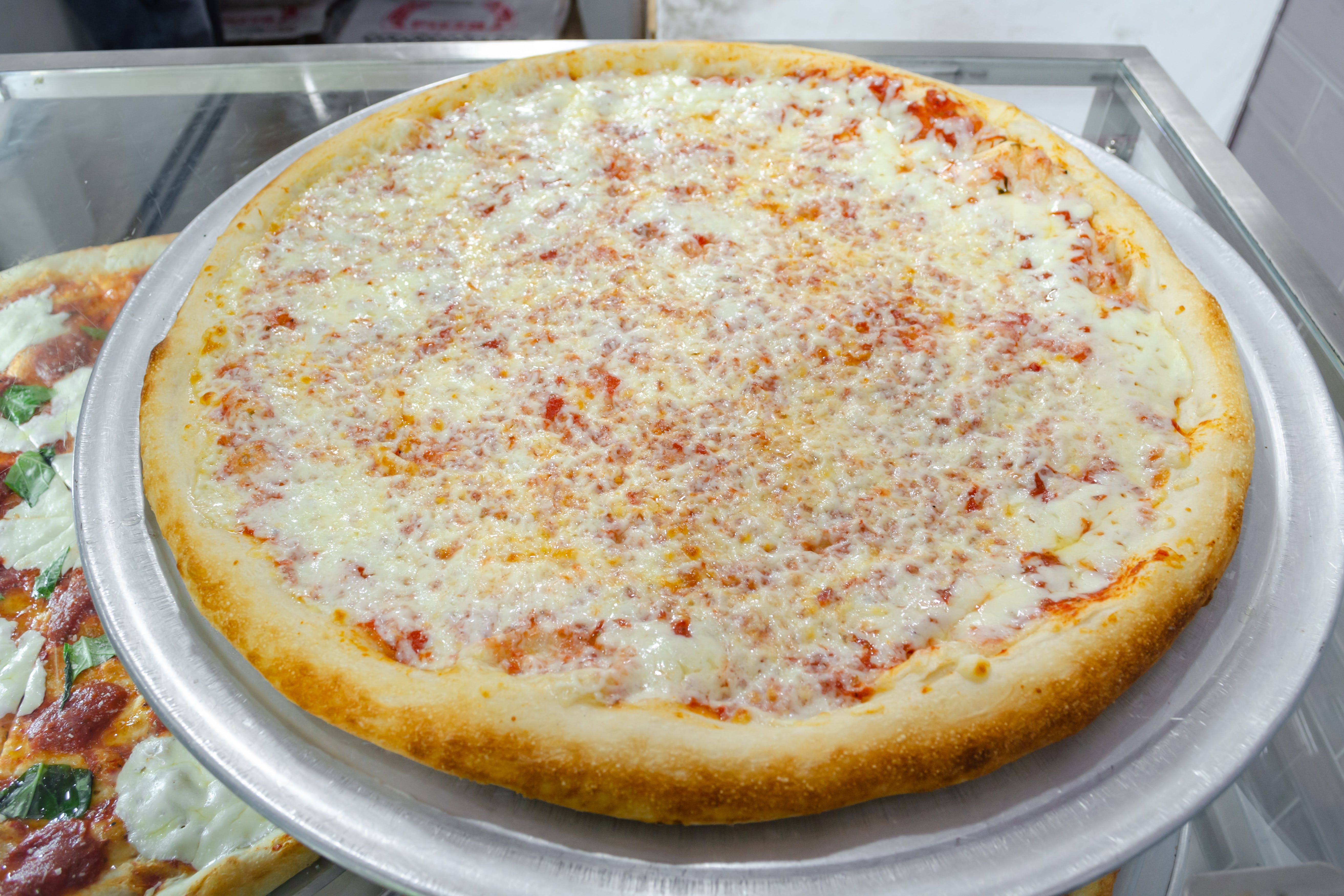 Order Cheese Pizza - 18'' food online from 99¢ Pizza & Hot Dog store, New York on bringmethat.com