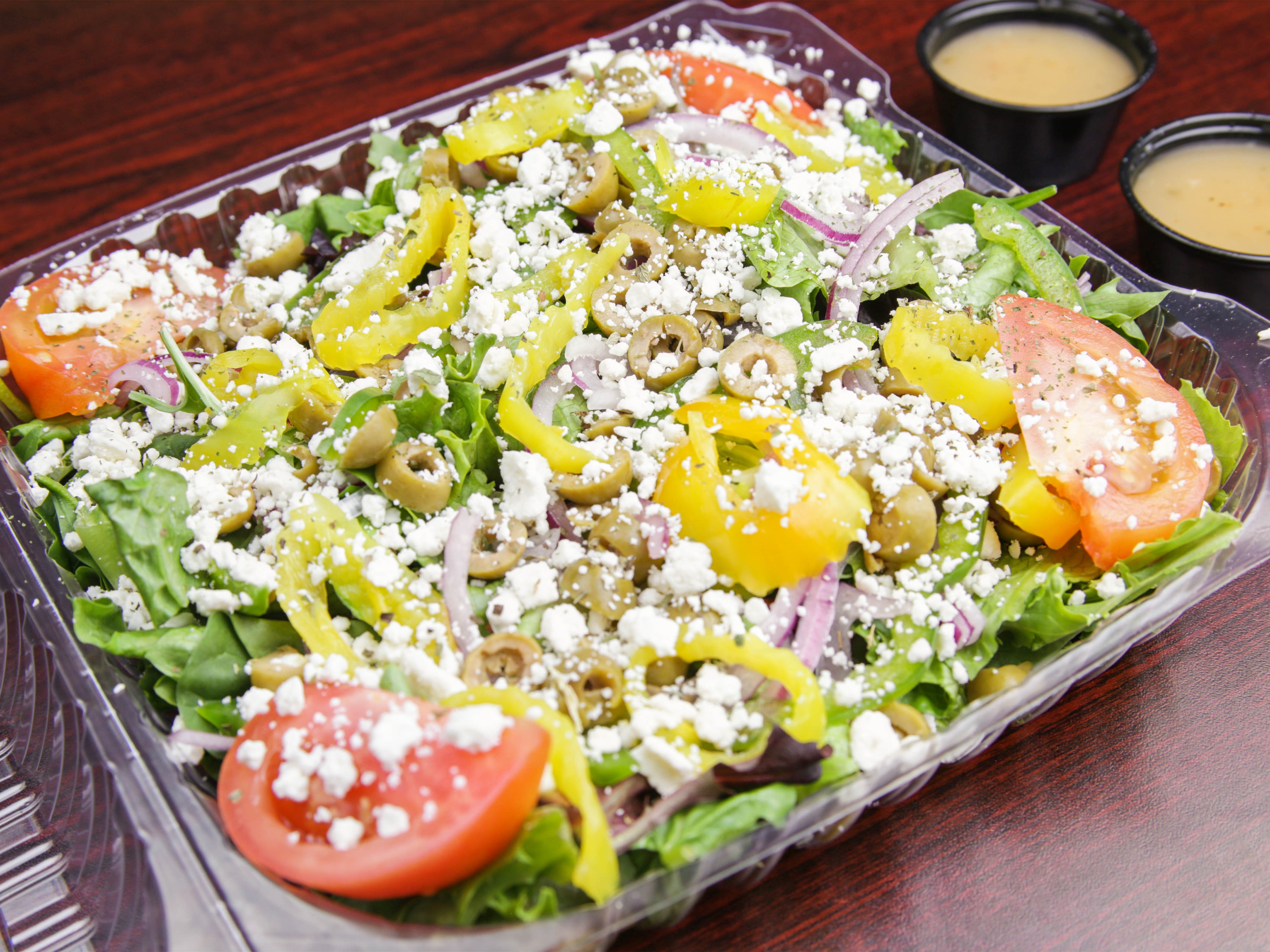 Order Greek Salad food online from Rino D's Pizza & Wings store, Gilbert on bringmethat.com