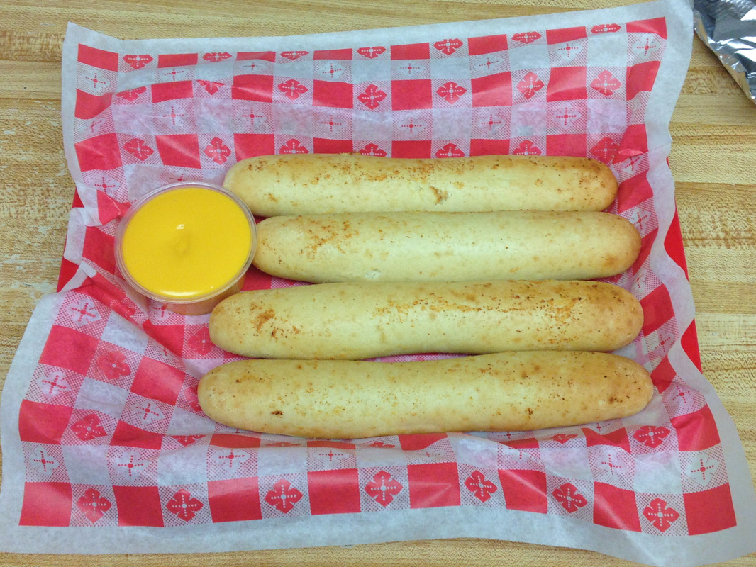 Order Breadsticks food online from Americana Pizza store, Centerville on bringmethat.com
