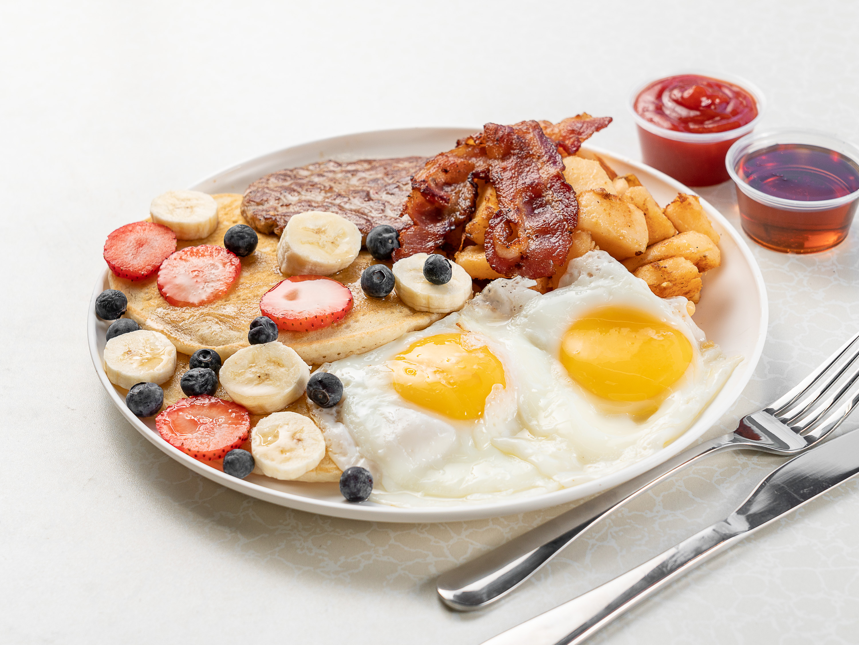 Order #5 Home Fries, 2 Pancakes, Eggs, and Breakfast Meat food online from 270 Deli NY store, Hempstead on bringmethat.com