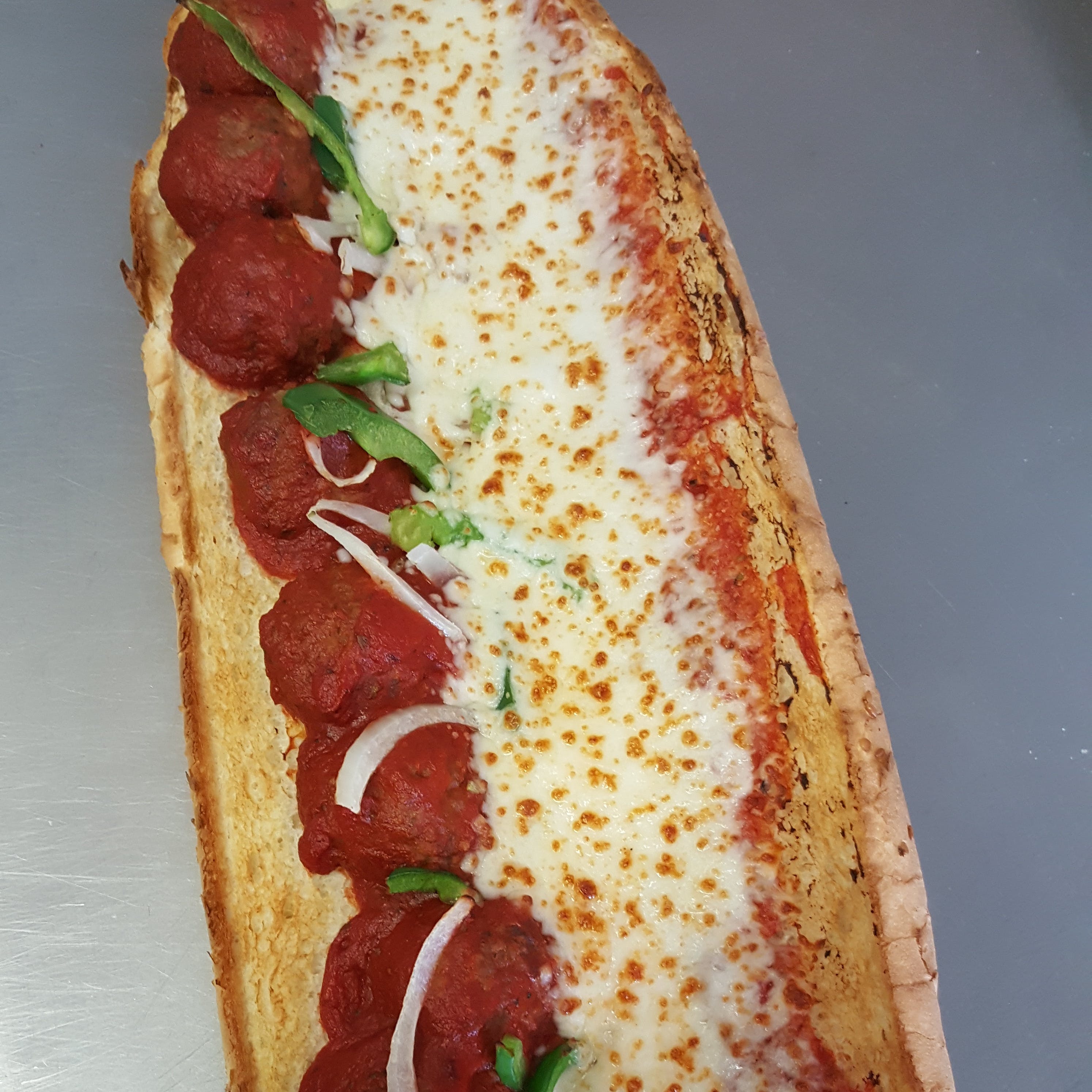 Order Meatball Sub - Half 8" food online from Valentino's Pizza store, Livonia on bringmethat.com