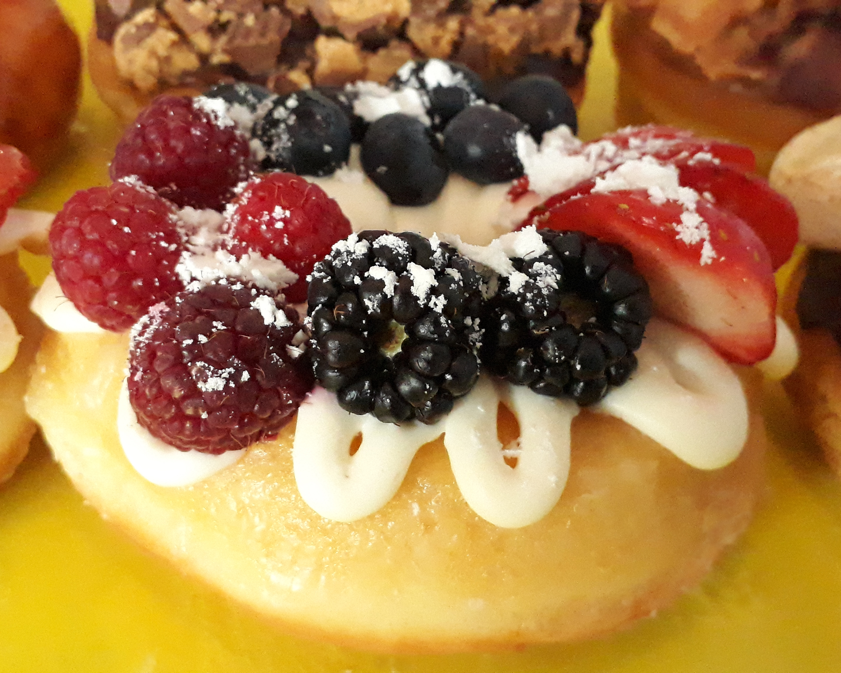 Order Cream Cheese & Mixed Berry Donut food online from Jaram's Donuts store, Dallas on bringmethat.com
