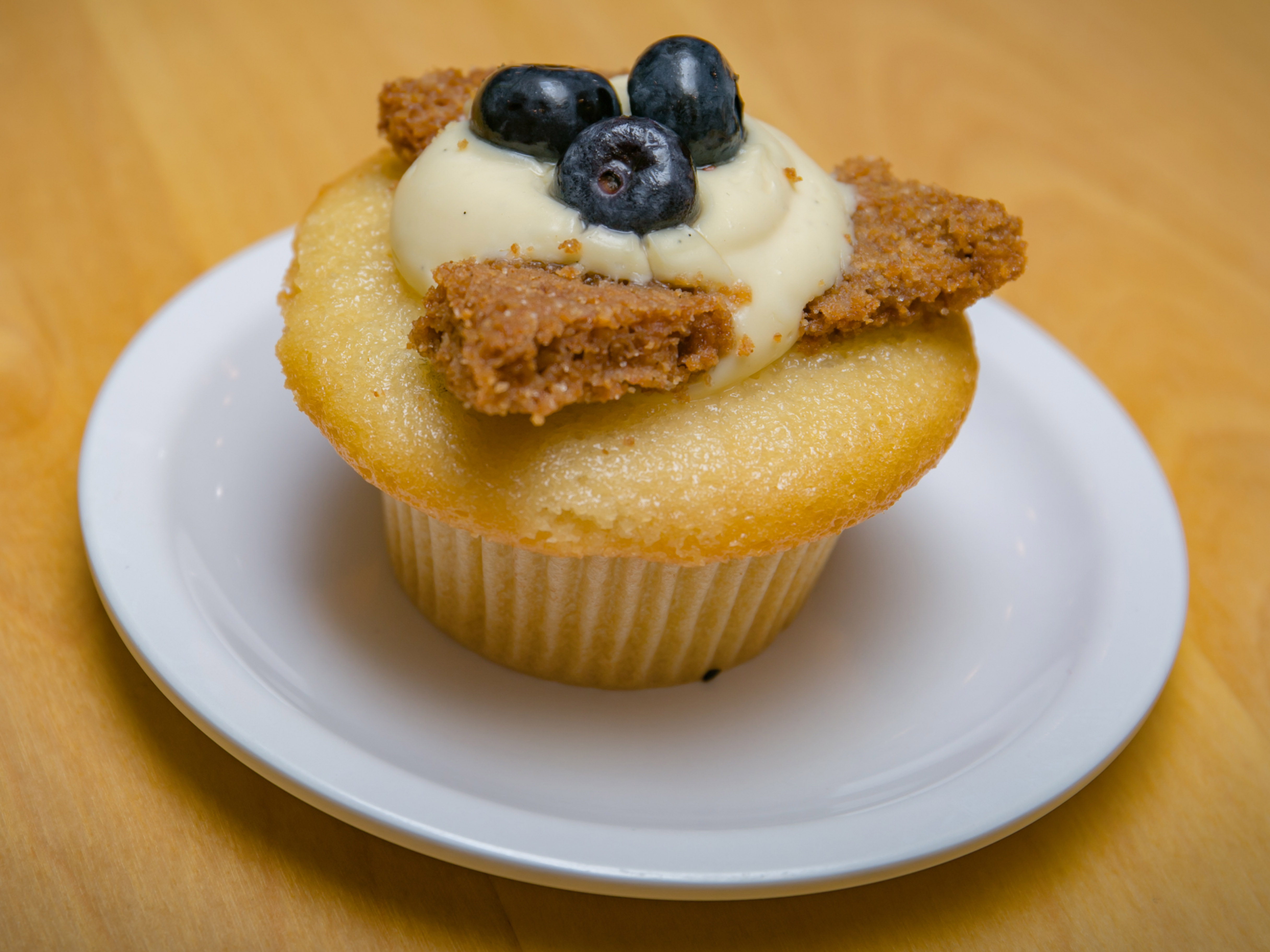Order Blueberry Cheesecake Cupcake food online from Molly Cupcakes store, Orland Park on bringmethat.com