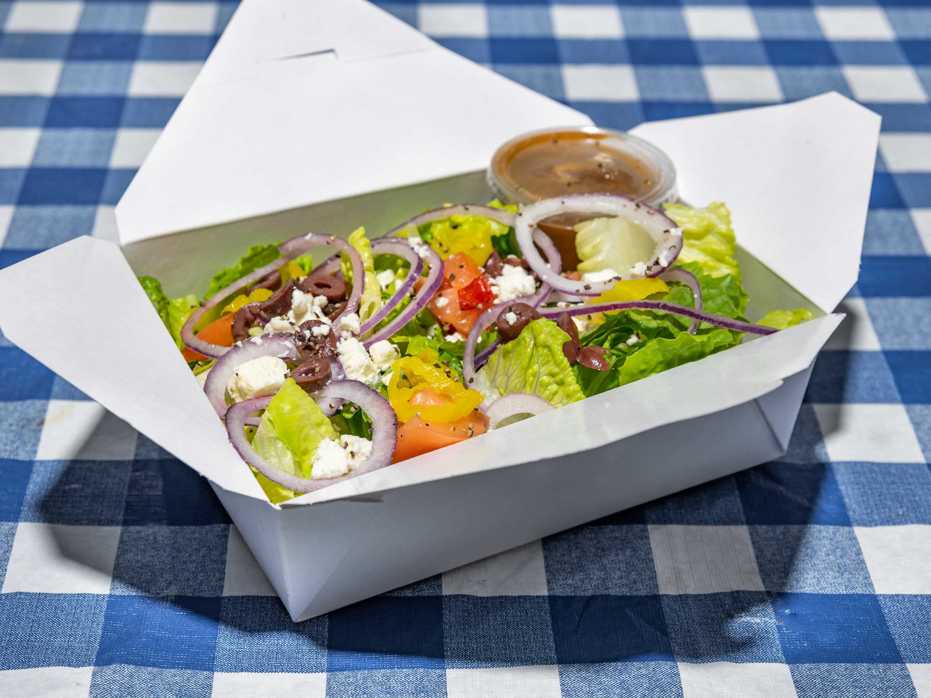 Order Greek Salad food online from Topolino's Pizza store, Seattle on bringmethat.com