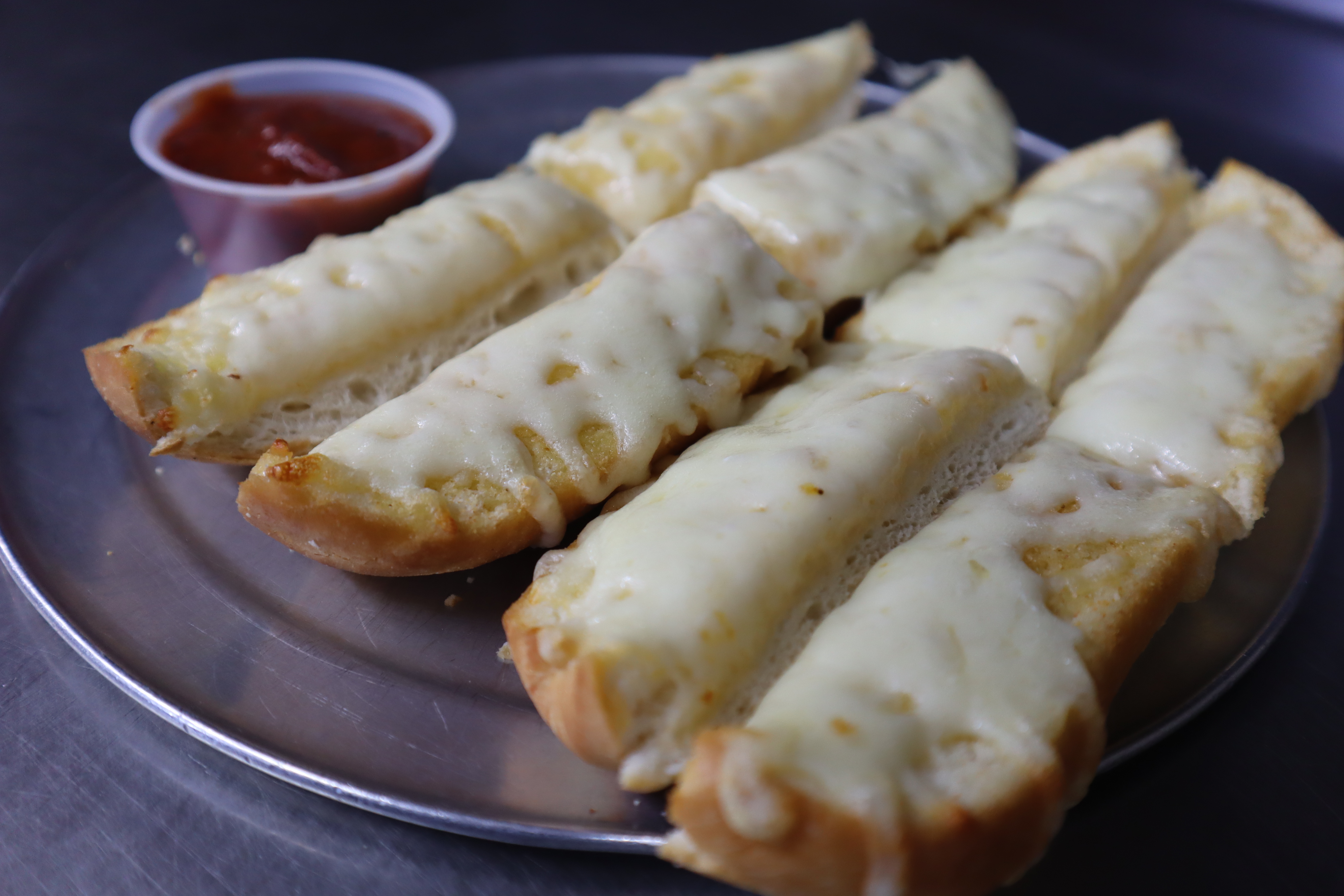 Order Garlic Bread with Cheese food online from Angilo's Pizza store, Louisville on bringmethat.com