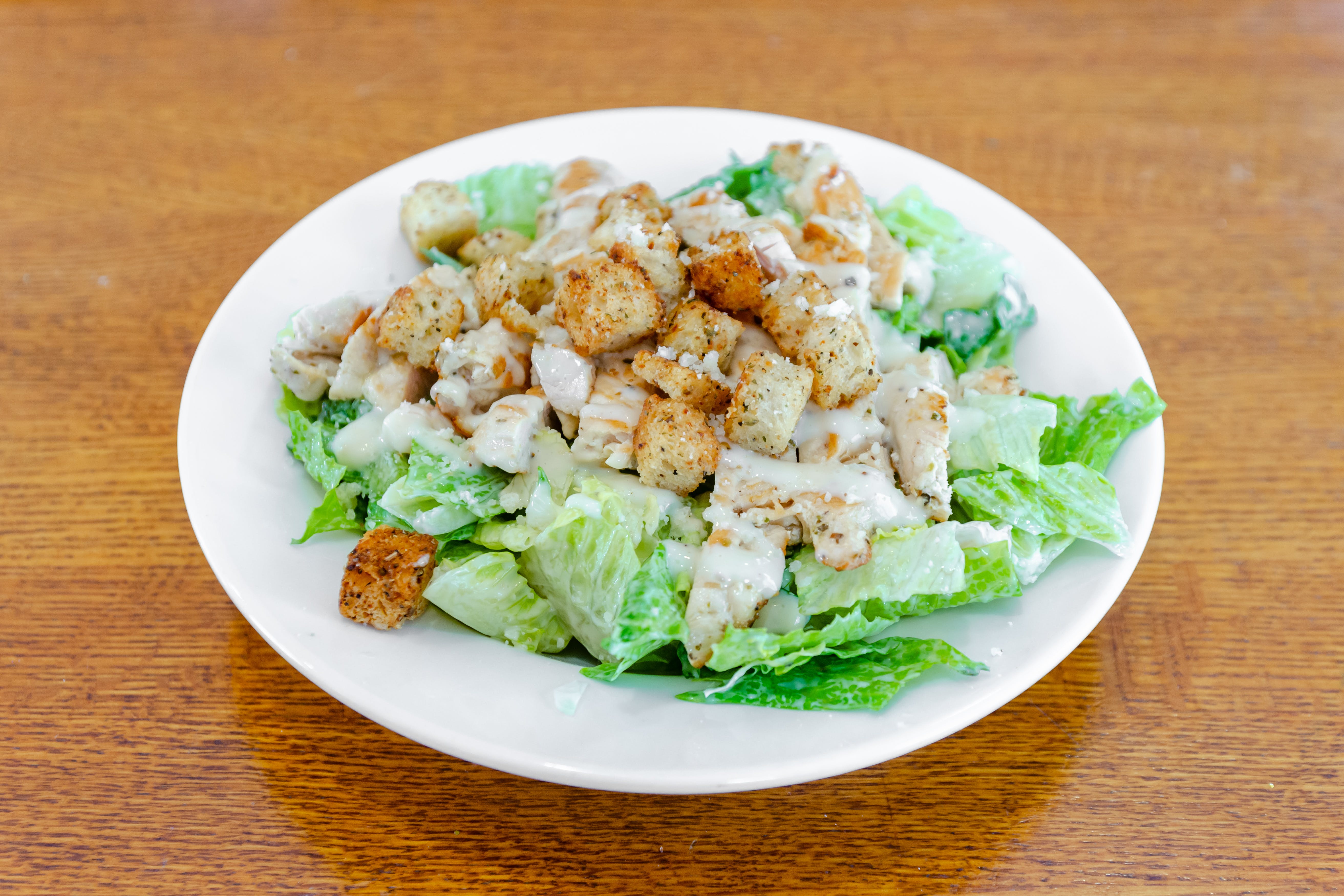 Order Caesar Salad with Grilled Chicken - Small food online from Loradella's family pizzeria store, Jersey City on bringmethat.com