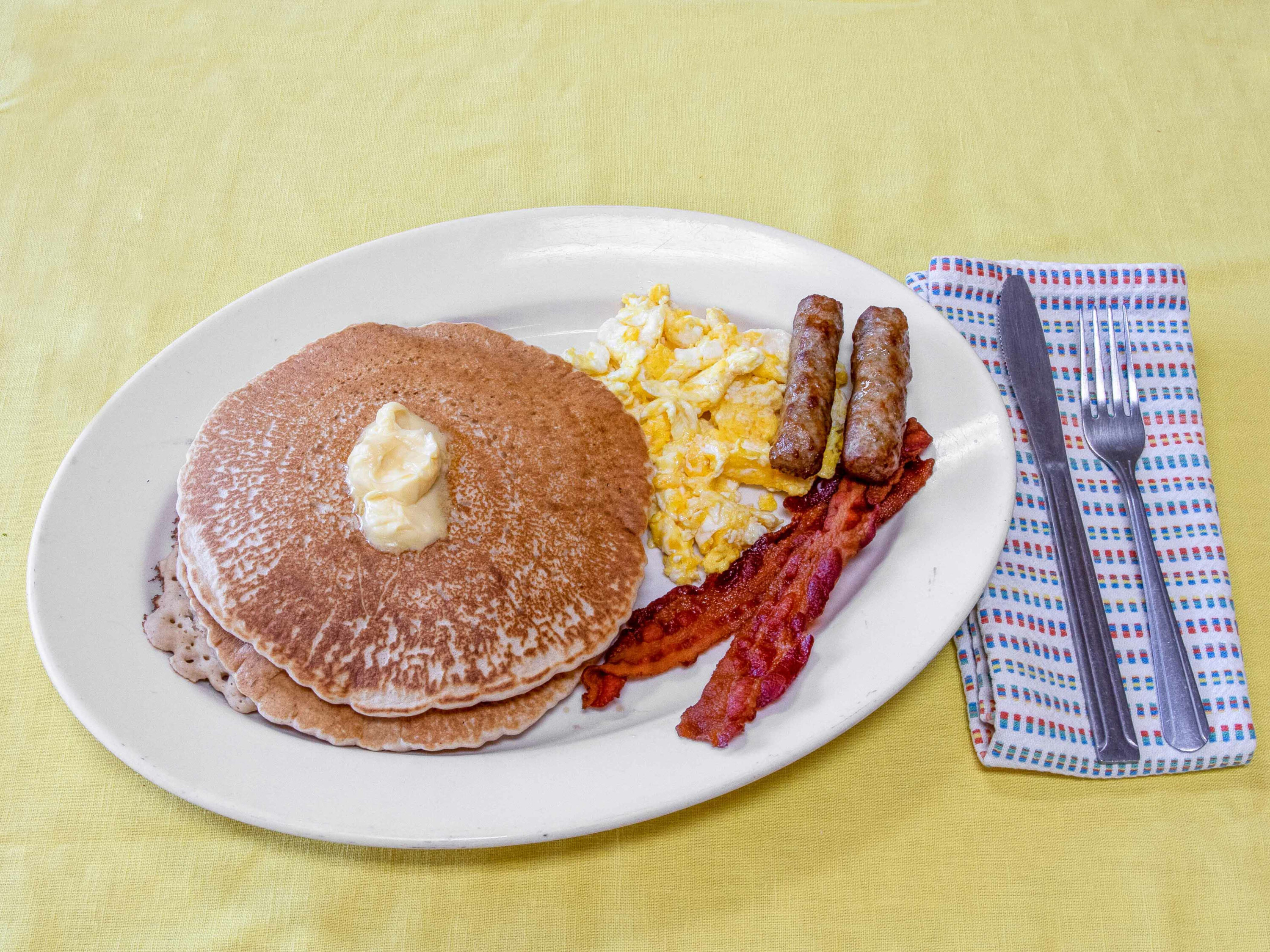 Order Pancakes with Eggs, Bacon and Sausage food online from Don Lencho's Authentic Mexican Food store, West Covina on bringmethat.com
