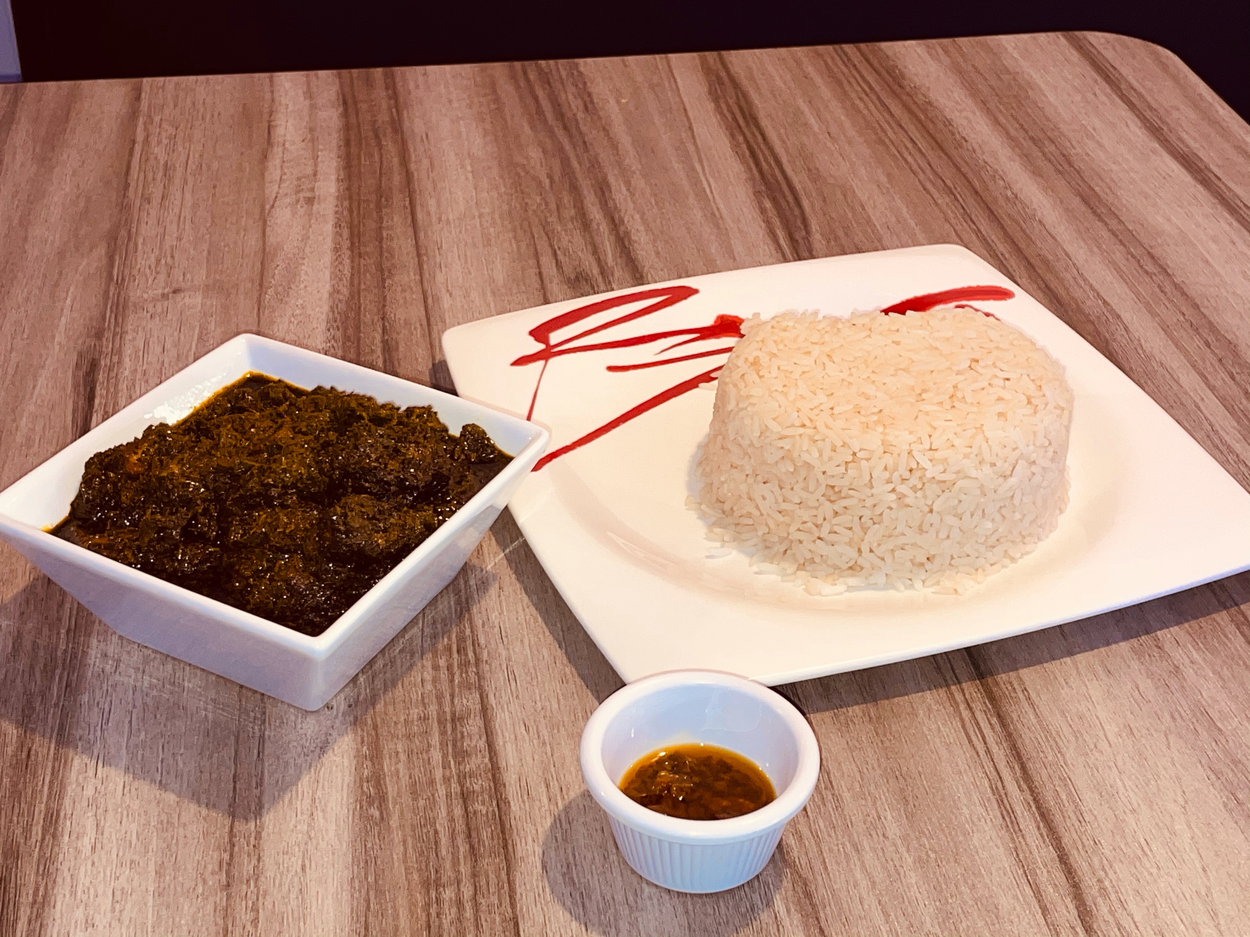 Order  Non spicy Cassava Leaf and chicken with rice  food online from Food Geez Restaurant store, Philadelphia on bringmethat.com