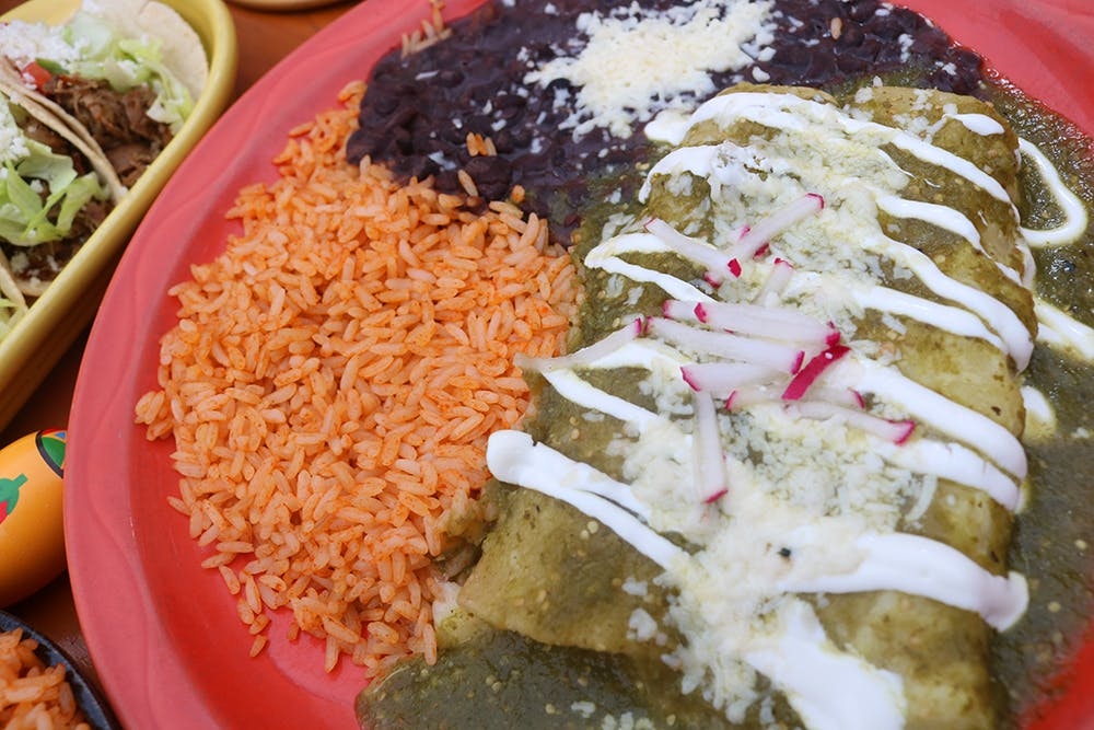 Order Enchilada De Pollo food online from Mad Dog And Beans store, New York on bringmethat.com