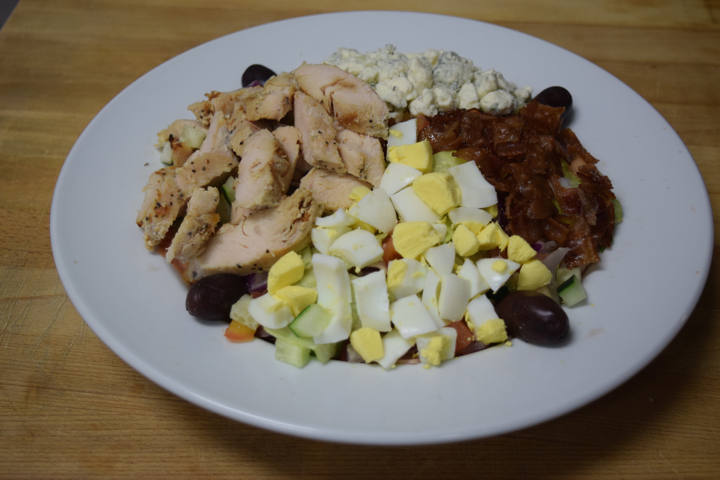 Order Cobb Salad food online from Cuzino Pizza & Pasta store, North East on bringmethat.com