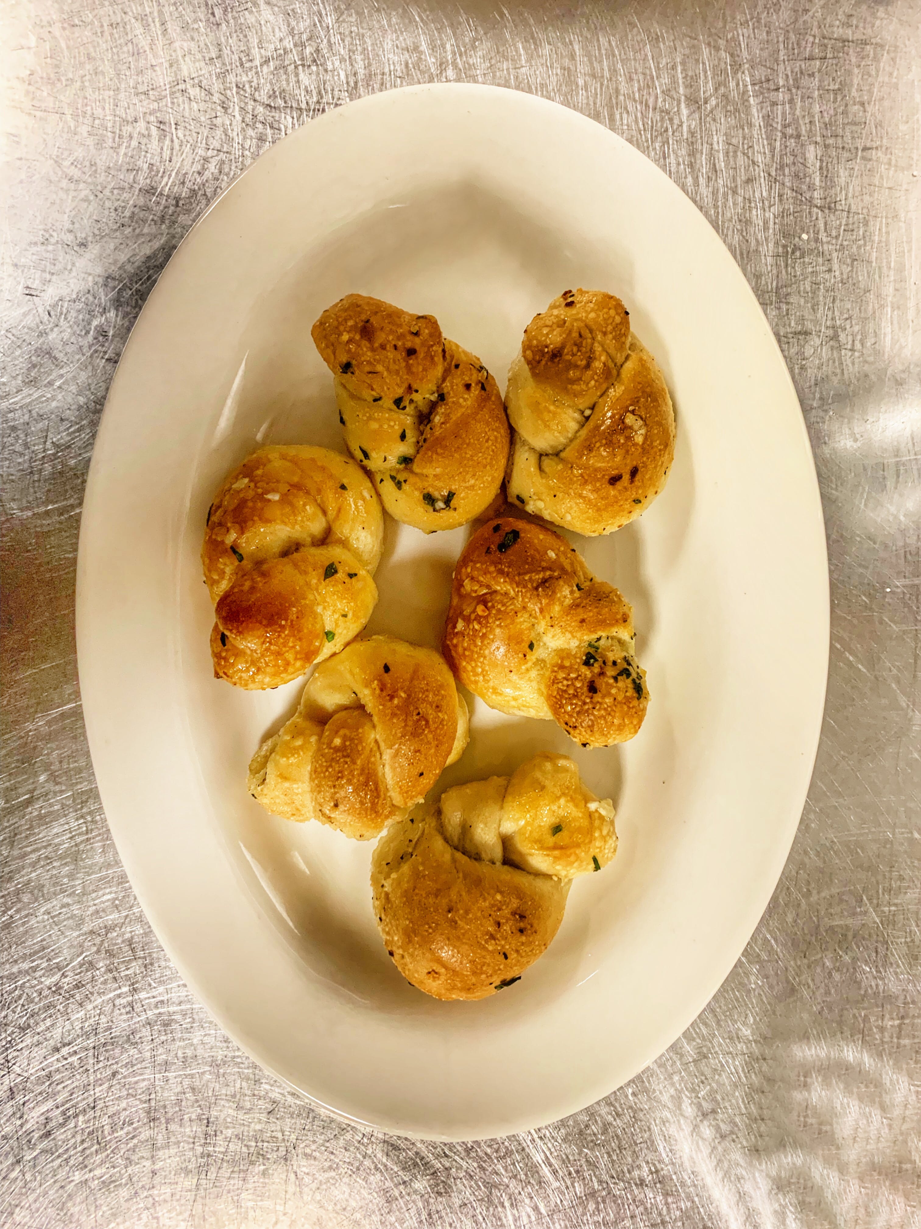 Order Garlic Knots - Side food online from Amore Cucina store, Stamford on bringmethat.com
