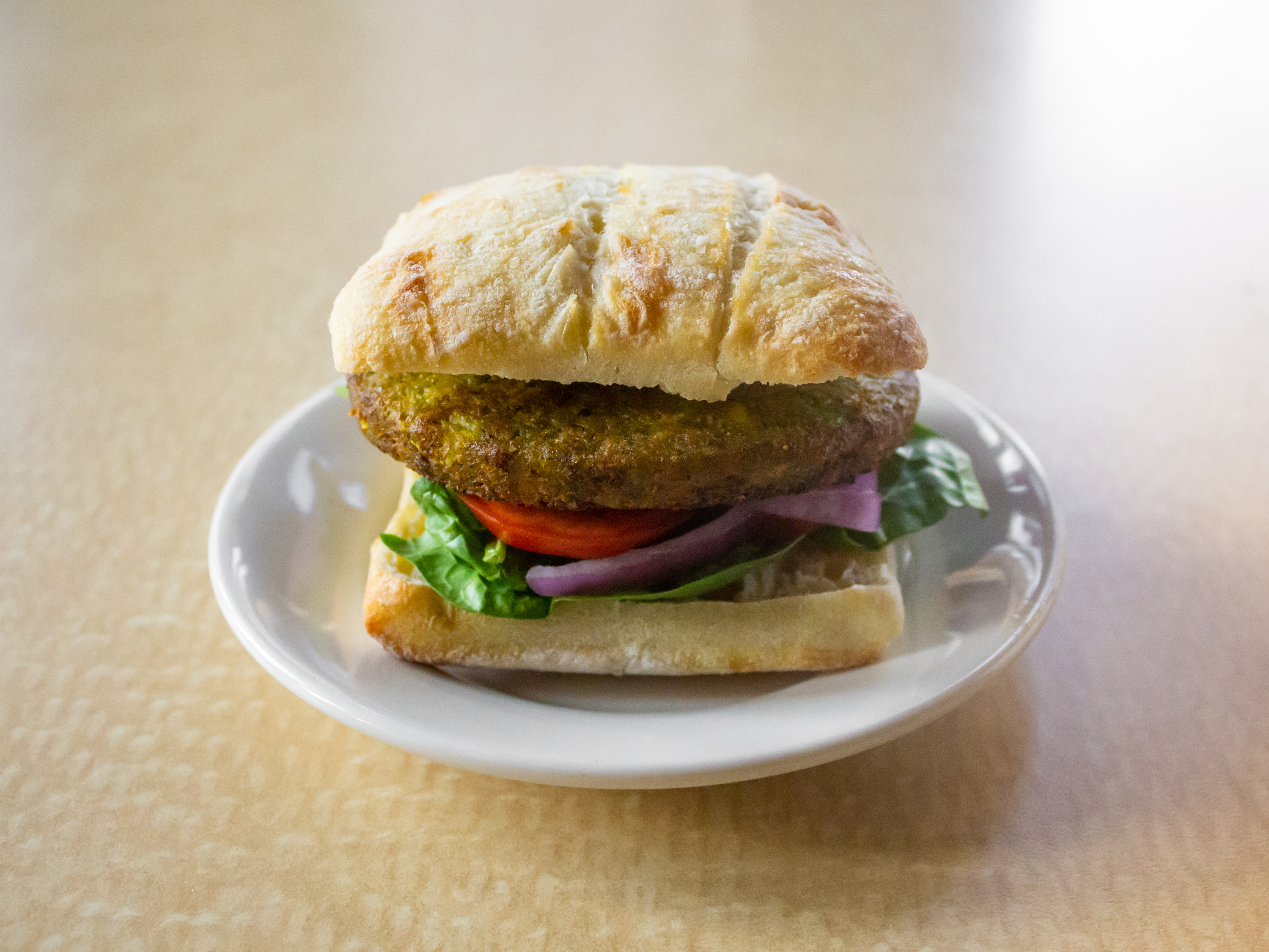 Order Vegan Burger (V) food online from 1872 Cafe store, Rochester on bringmethat.com