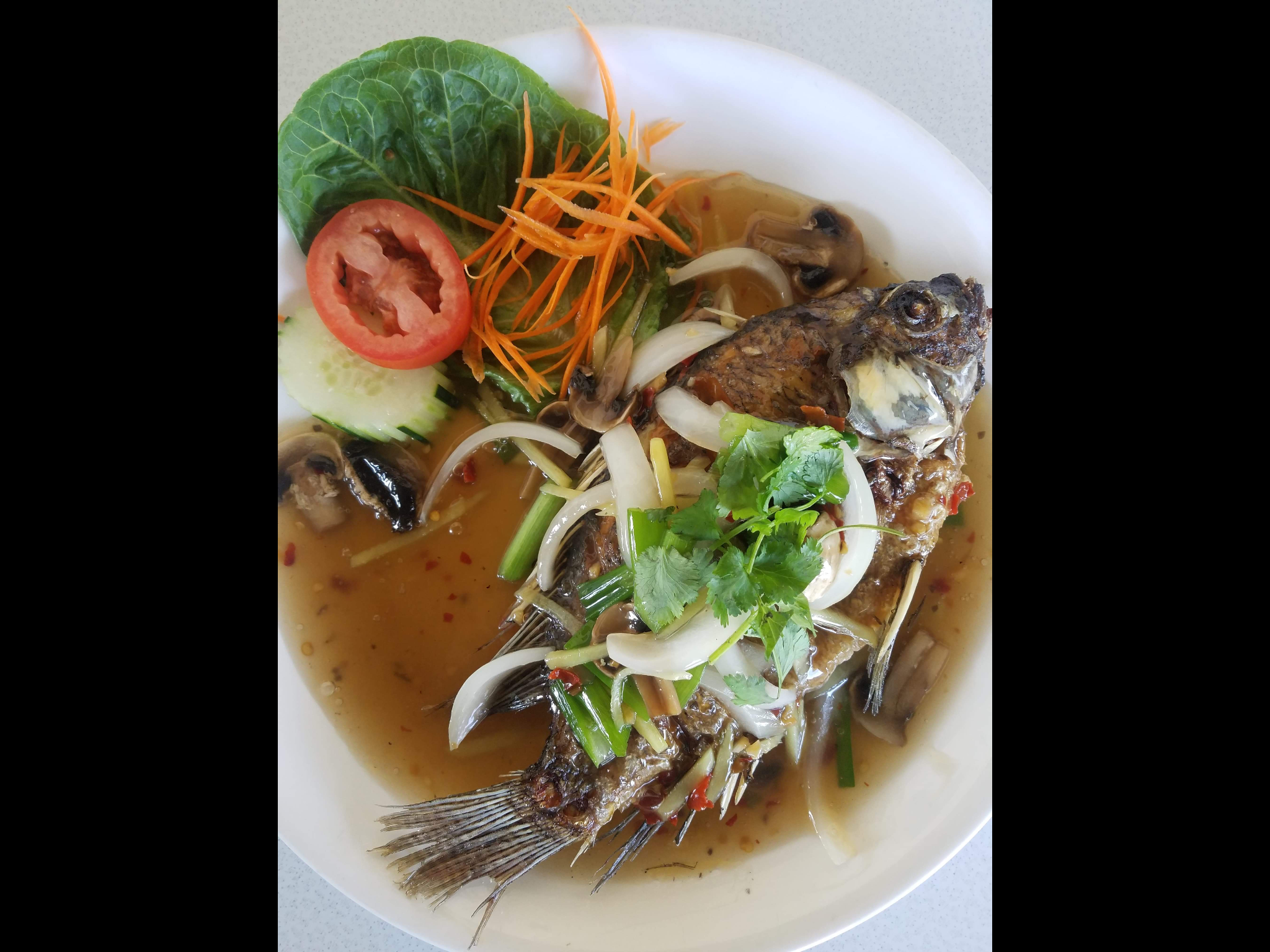 Order Fried Whole Tilapia  food online from Thai Bbq & Noodles store, Cypress on bringmethat.com