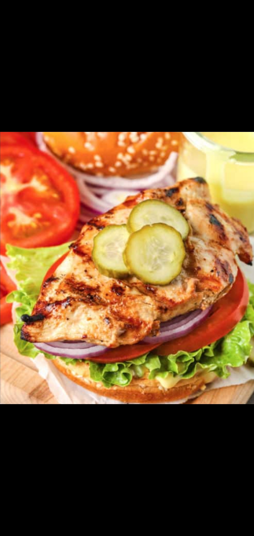 Order  Grilled Chicken Signature Sandwich Special (grilled chicken pickles red onions romaine lettuce & tomatoes) food online from American Gourmet Foods Deli store, New York on bringmethat.com