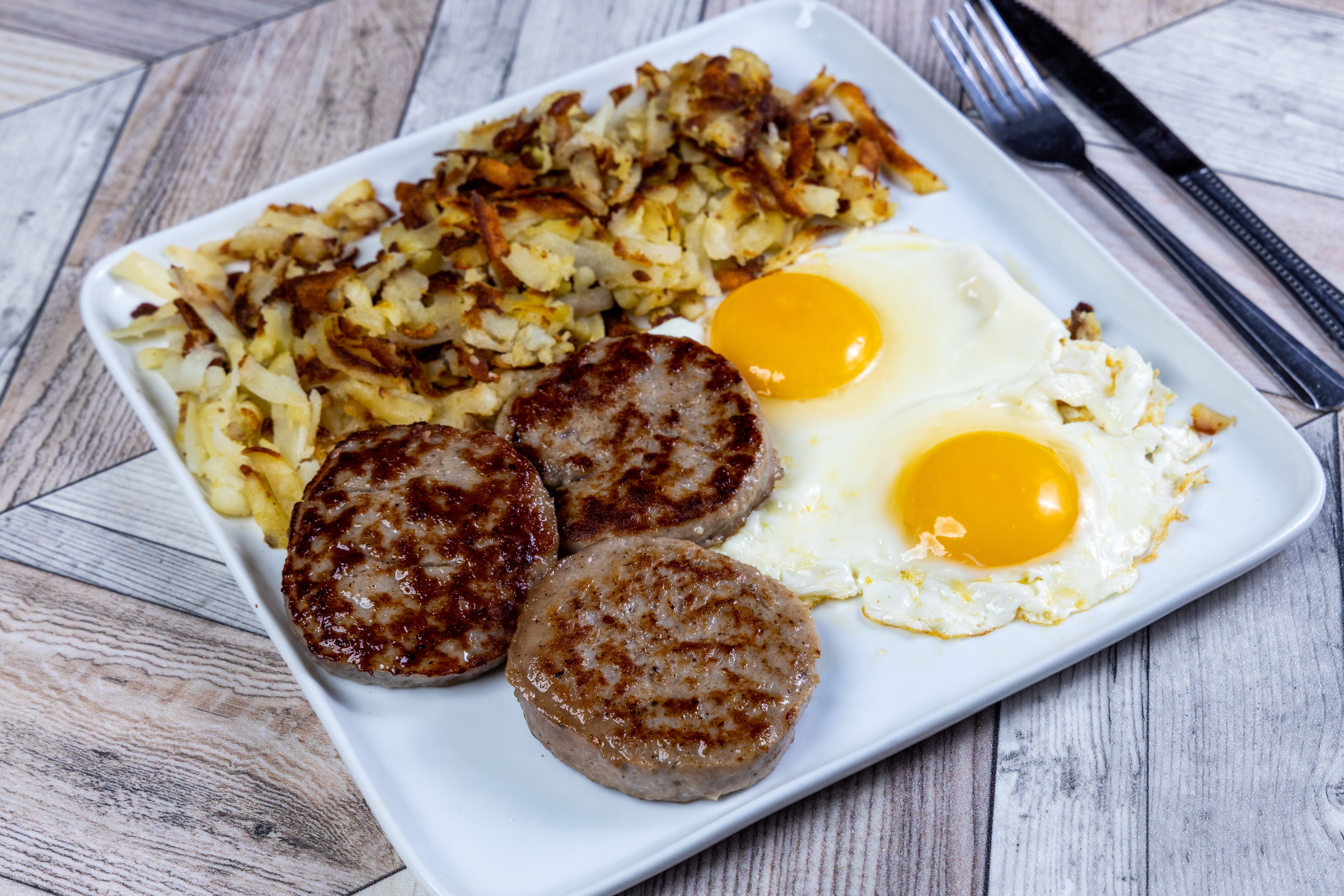 Order Extra Large Eggs Any Style with Sausage Patties food online from Top View Restaurant store, Chicago on bringmethat.com