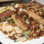 Order 68. Chicken Seekh Kabab Biryani food online from Taj Restaurant store, Warren on bringmethat.com