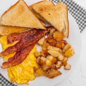 Order TWO EGGS with Home Fries, White Toast, & Jelly food online from Steak In A Sack store, Fort Washington on bringmethat.com