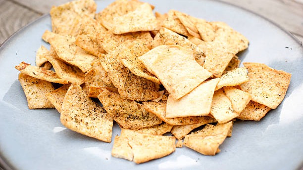 Order side house pita chips food online from Zaytoon Mediterranean Grill store, Greensboro on bringmethat.com