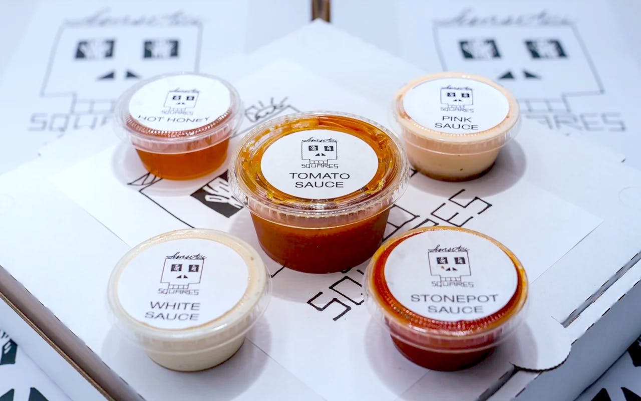 Order Home Made Hot Honey - Small food online from Sunset Squares Slice Shop store, San Francisco on bringmethat.com