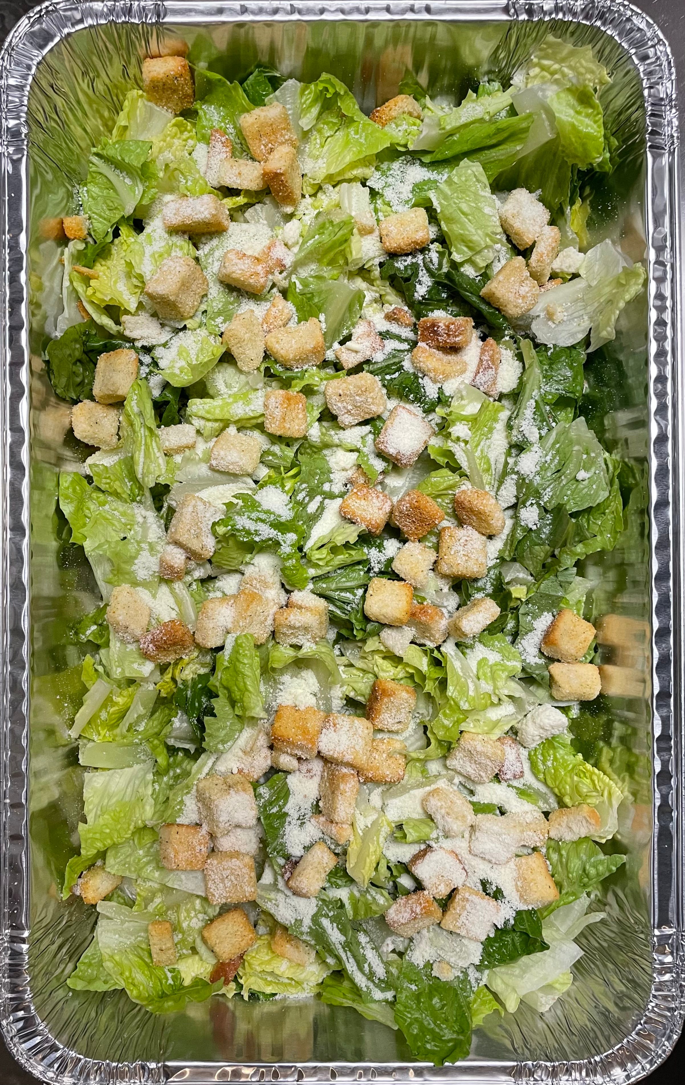 Order Caesar Salad Catering - Half Tray (Serves 8-10 People) food online from Brooklyn Pizza & Pasta store, Cincinnati on bringmethat.com