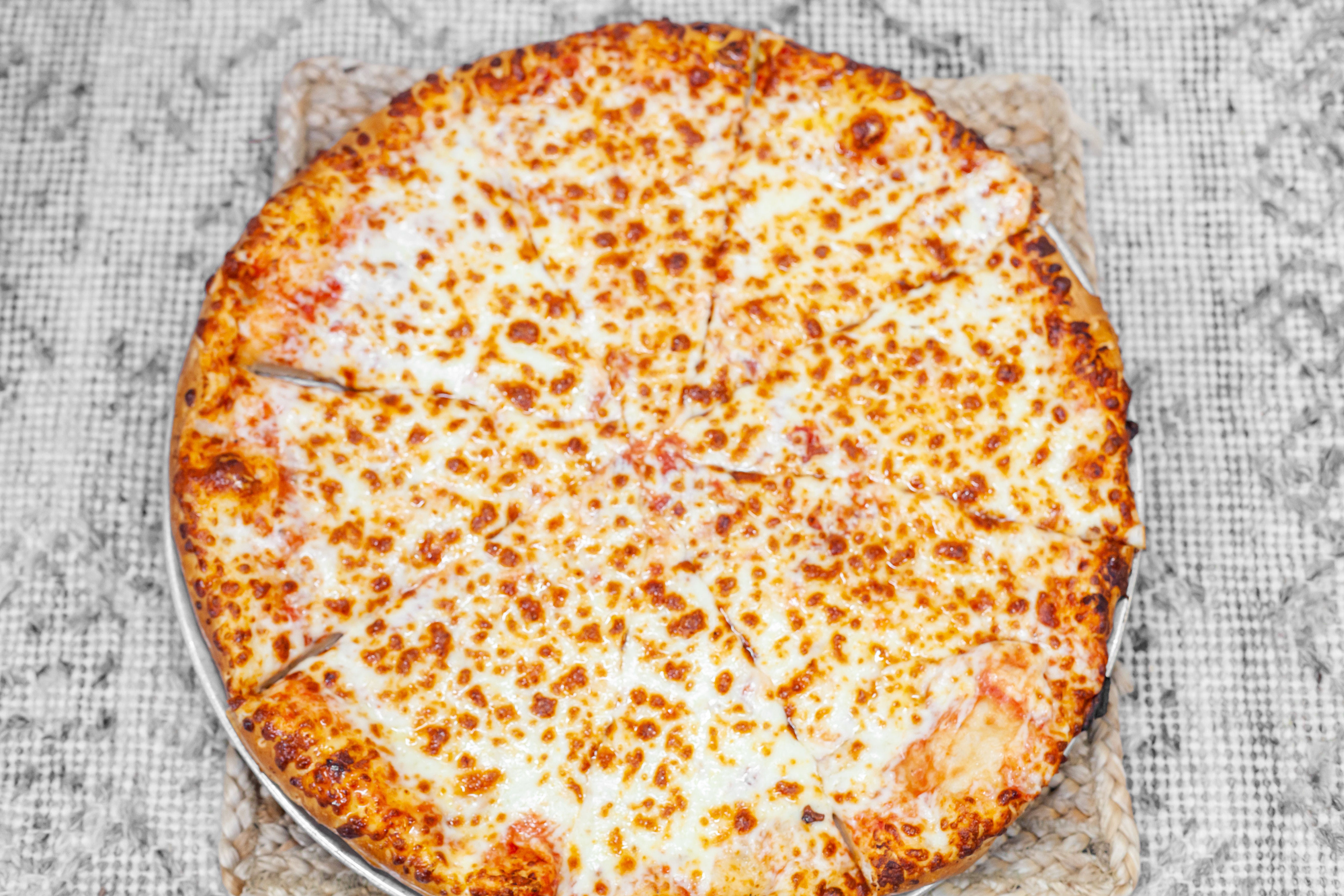 Order Cheese Pizza with One Topping - Medium 12'' food online from Howell 2 Go store, Howell on bringmethat.com
