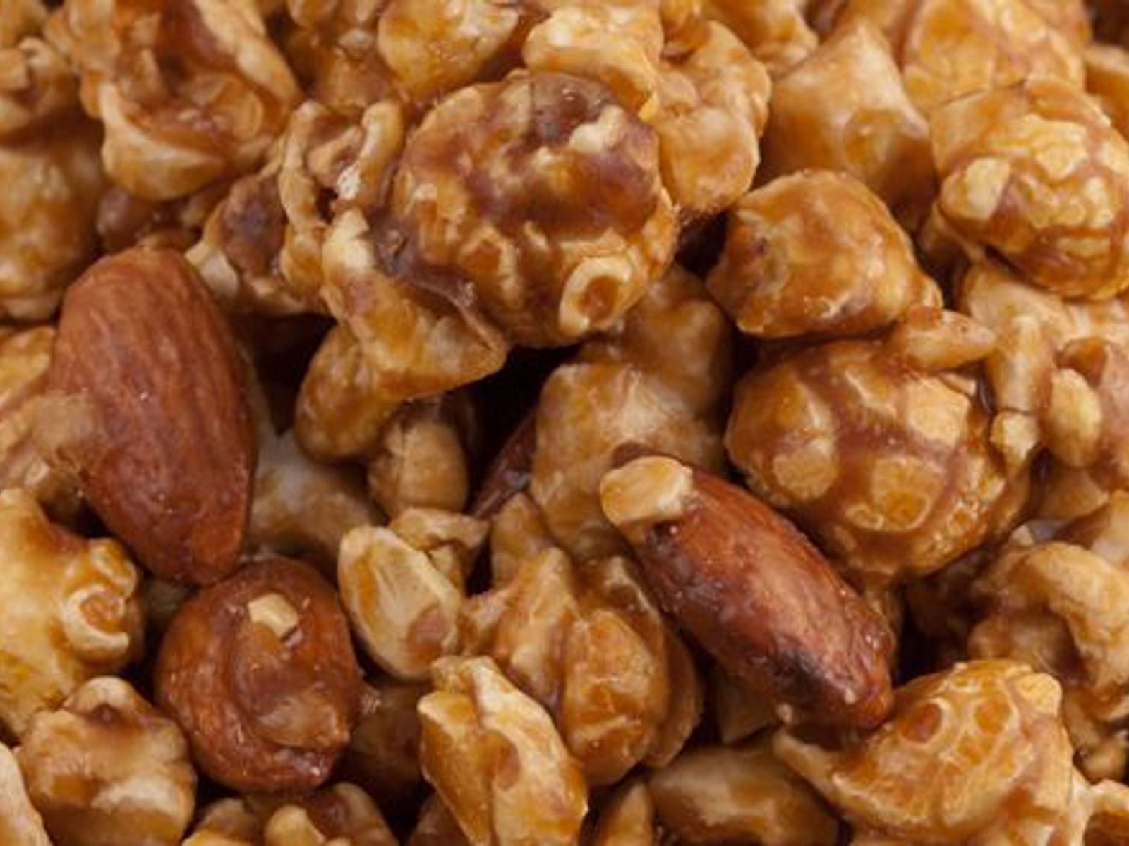 Order TOFFEE ALMOND food online from Poparazzis Popcorn store, Houston on bringmethat.com