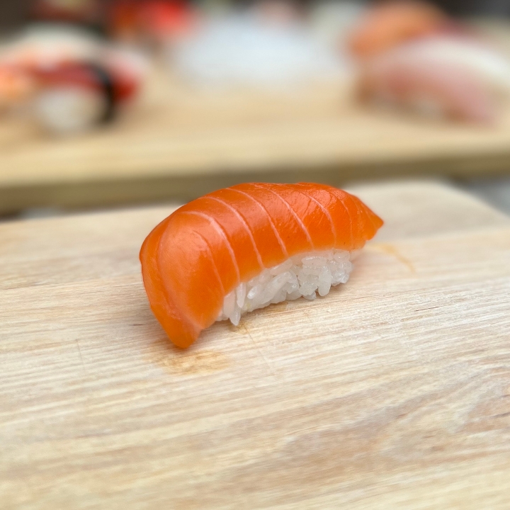 Order Nama Sake Nigiri food online from Tanuki sushi store, Chicago on bringmethat.com