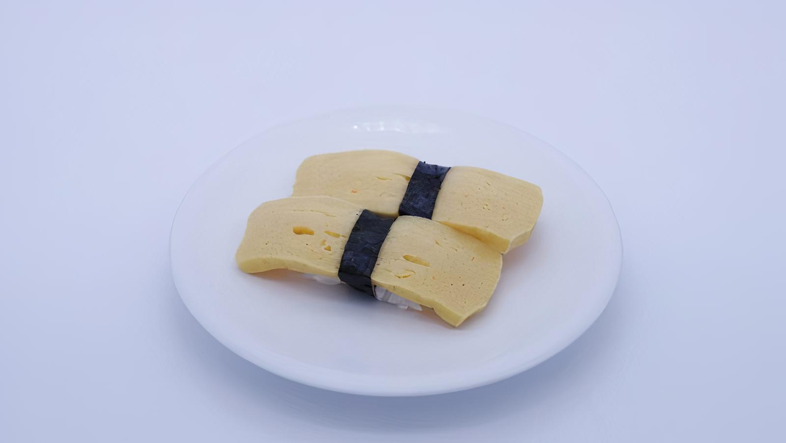 Order Tamago (2 Pieces) food online from Sapporo Revolving Sushi store, Las Vegas on bringmethat.com