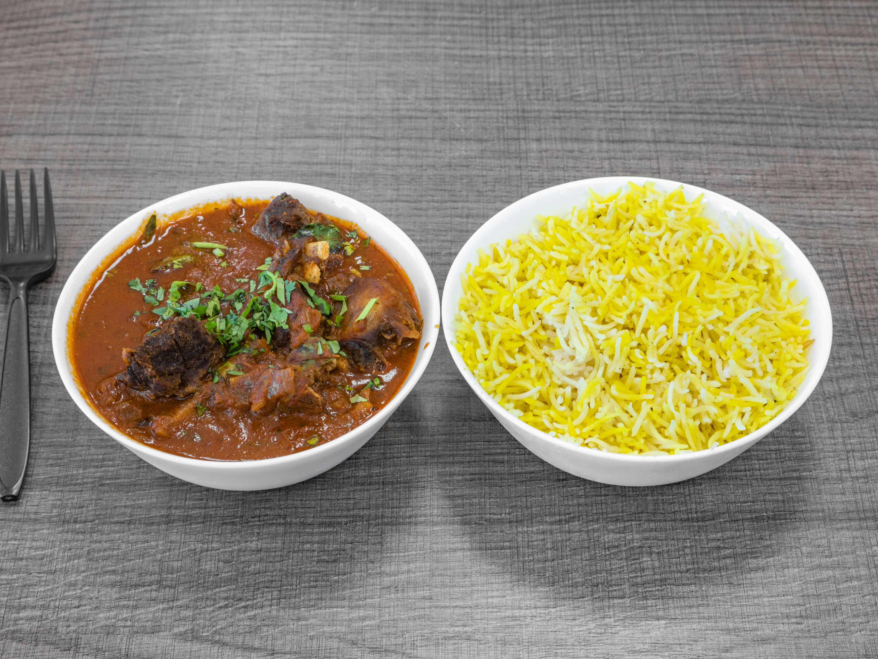 Order Goat Curry food online from Saffron Indian Grocery N Kitchen store, Scottsdale on bringmethat.com