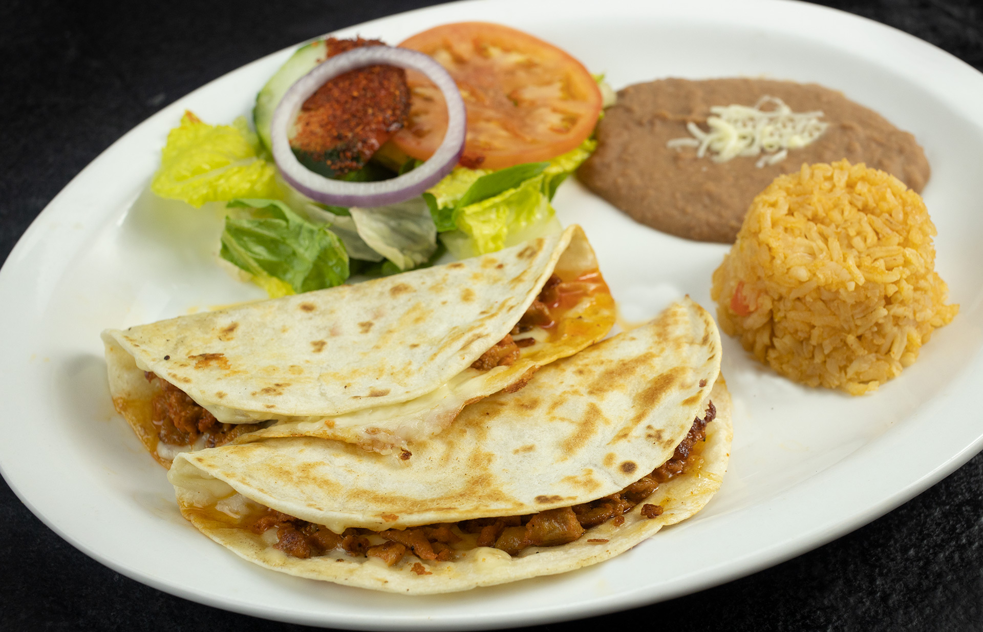 Order Quesadilla Platter with Rice & Beans food online from Taqueria Los Paisanos store, Saint Paul on bringmethat.com