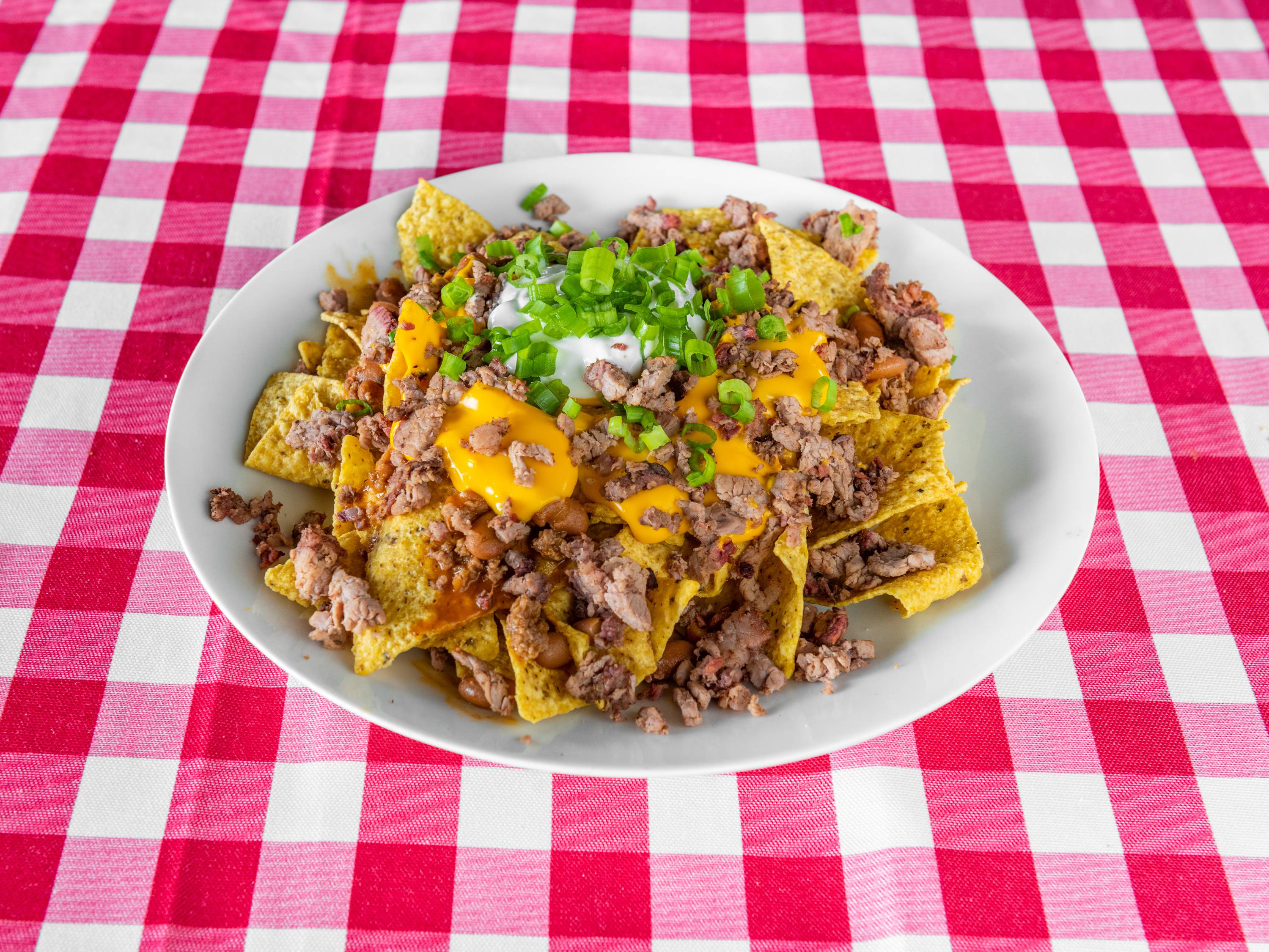 Order Loaded Brisket Nachos food online from Shaws Country Kitchen store, Round Rock on bringmethat.com