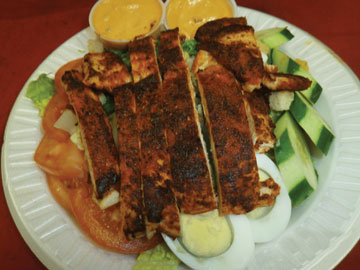 Order Tossed Salad with Blackened Chicken Breast  food online from Tharsy Grill store, Baltimore on bringmethat.com