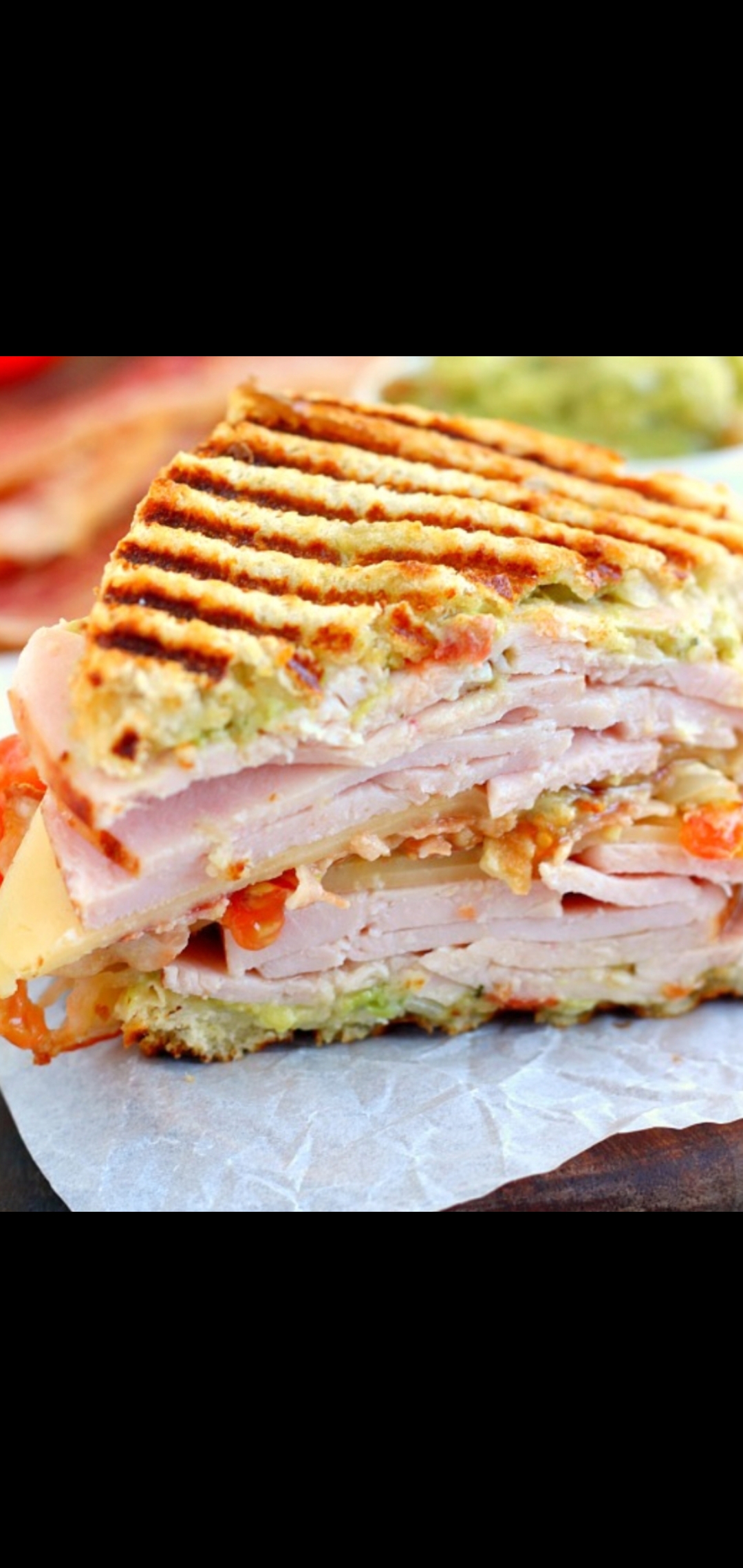Order Turkey Club Panini (turkey smoked bacon cheese tomatoes & house dressing) food online from American Gourmet Foods Deli store, New York on bringmethat.com