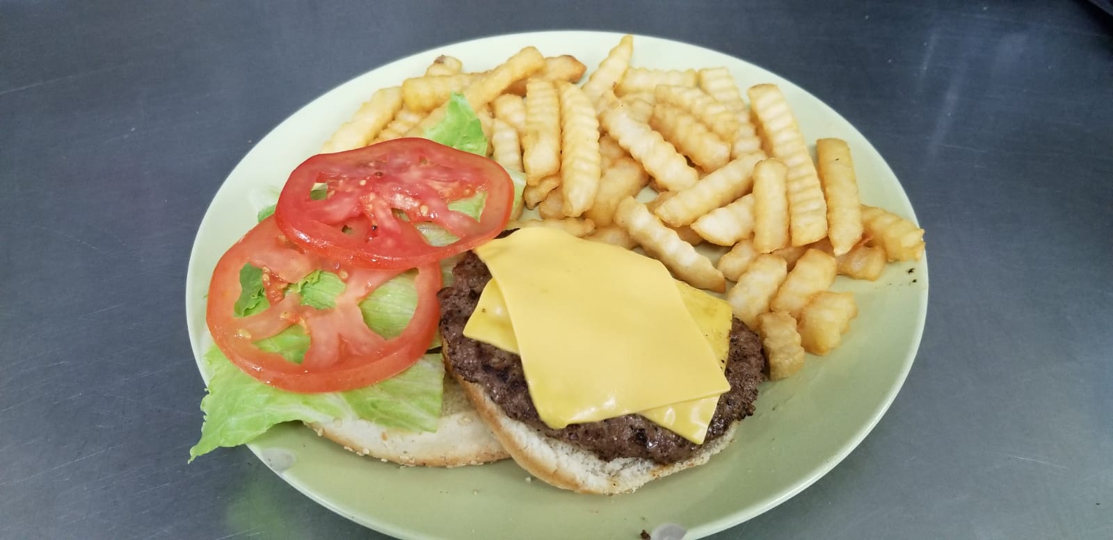 Order Cheese burger deluxe food online from Aminas Cafe store, Bronx on bringmethat.com