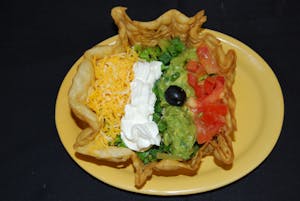Order J. Taco Salad with Chicken, Shredded Beef, Ground Beef or Carnitas with Guacamole & Sour Cream food online from Manuel's Mexican store, Tempe on bringmethat.com