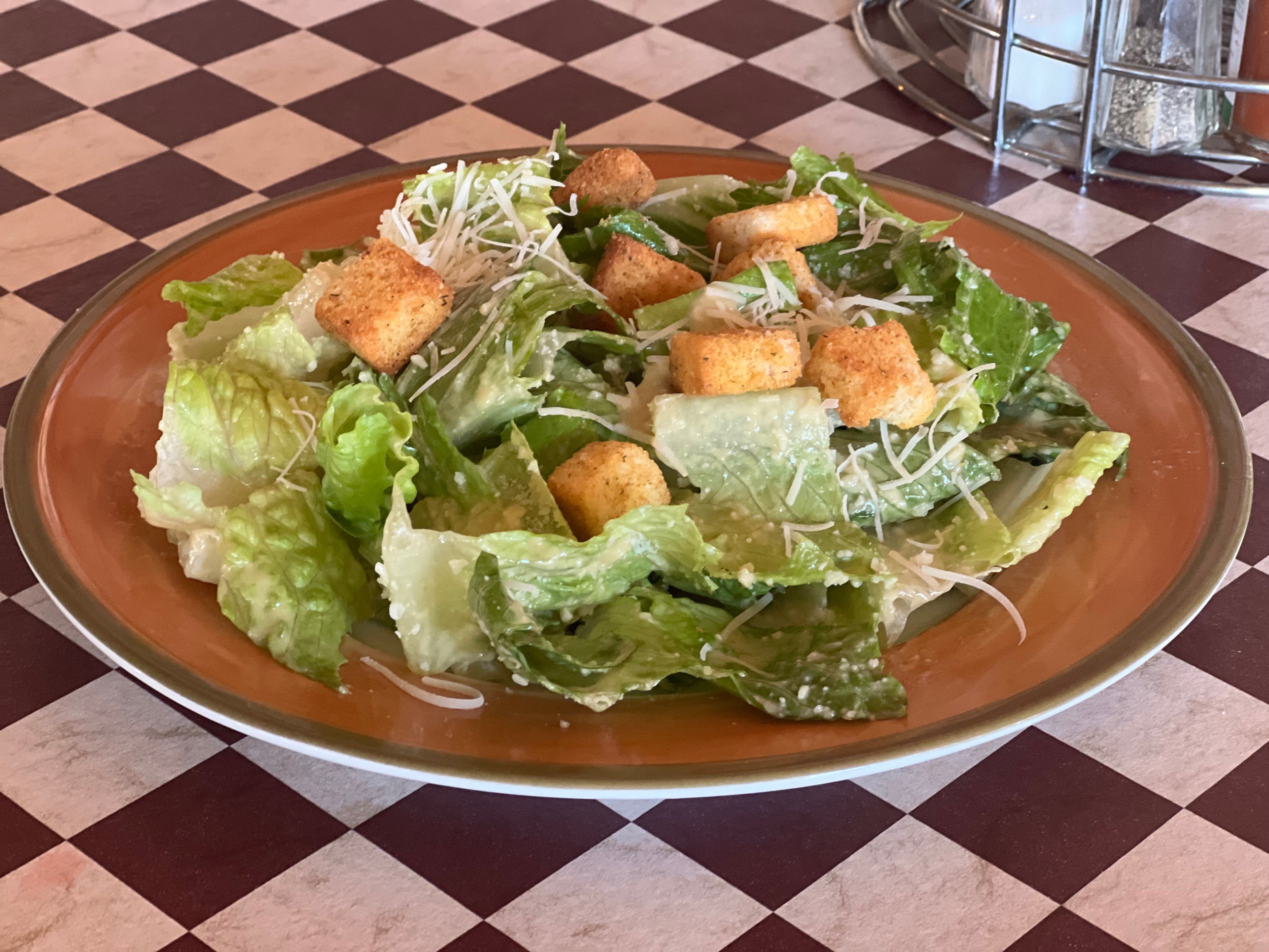 Order Caesar Salad - Salad food online from Village Pizza Restaurant store, Orinda on bringmethat.com