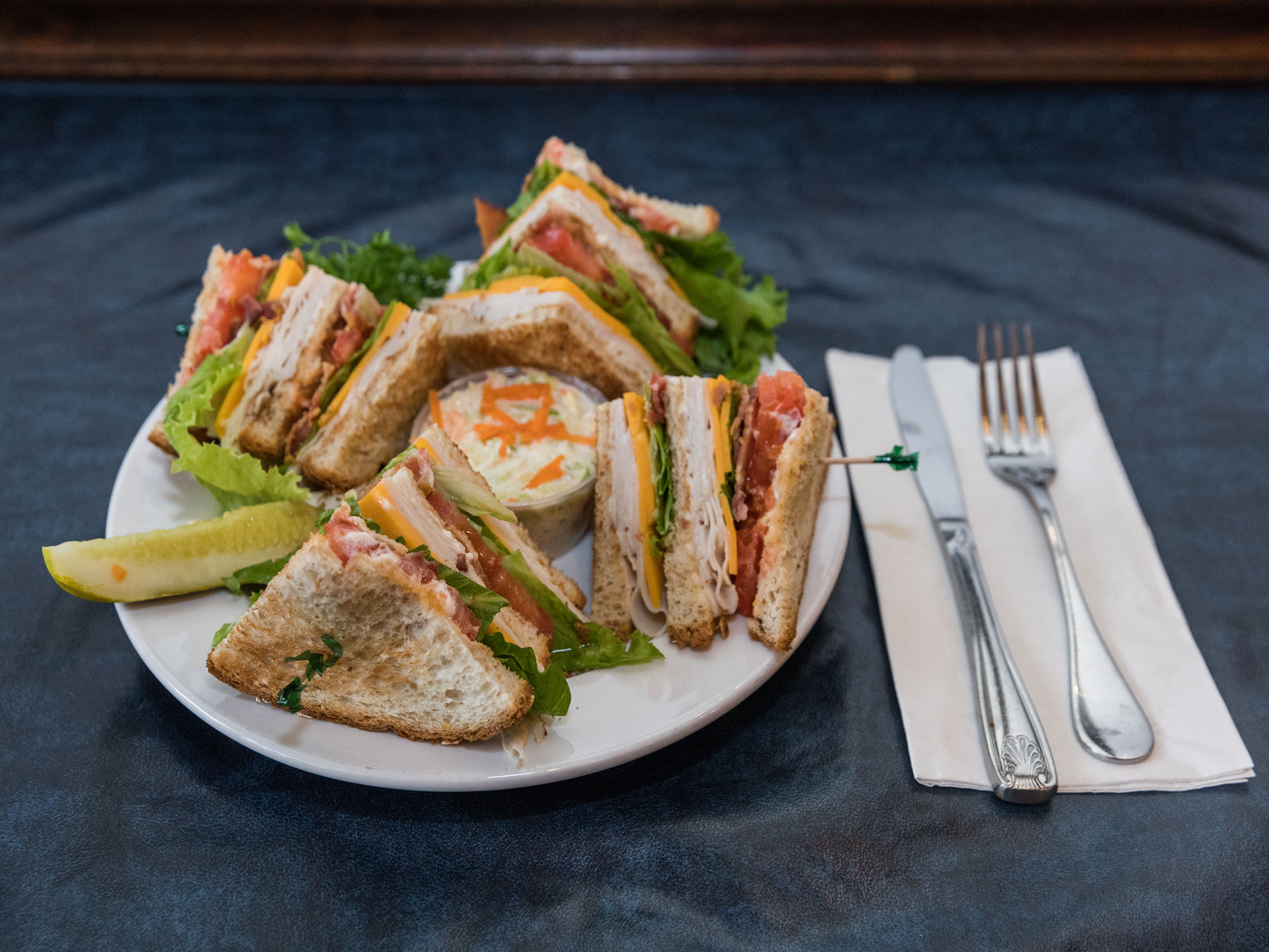 Order Turkey Club Sandwich food online from Bluffington's Cafe store, Lake Bluff on bringmethat.com