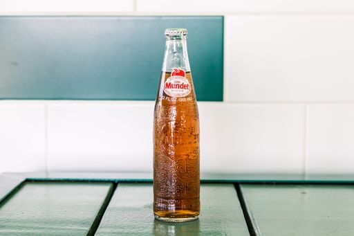 Order Sidral Mundet ( apple soda) food online from The Taco Stand store, Houston on bringmethat.com